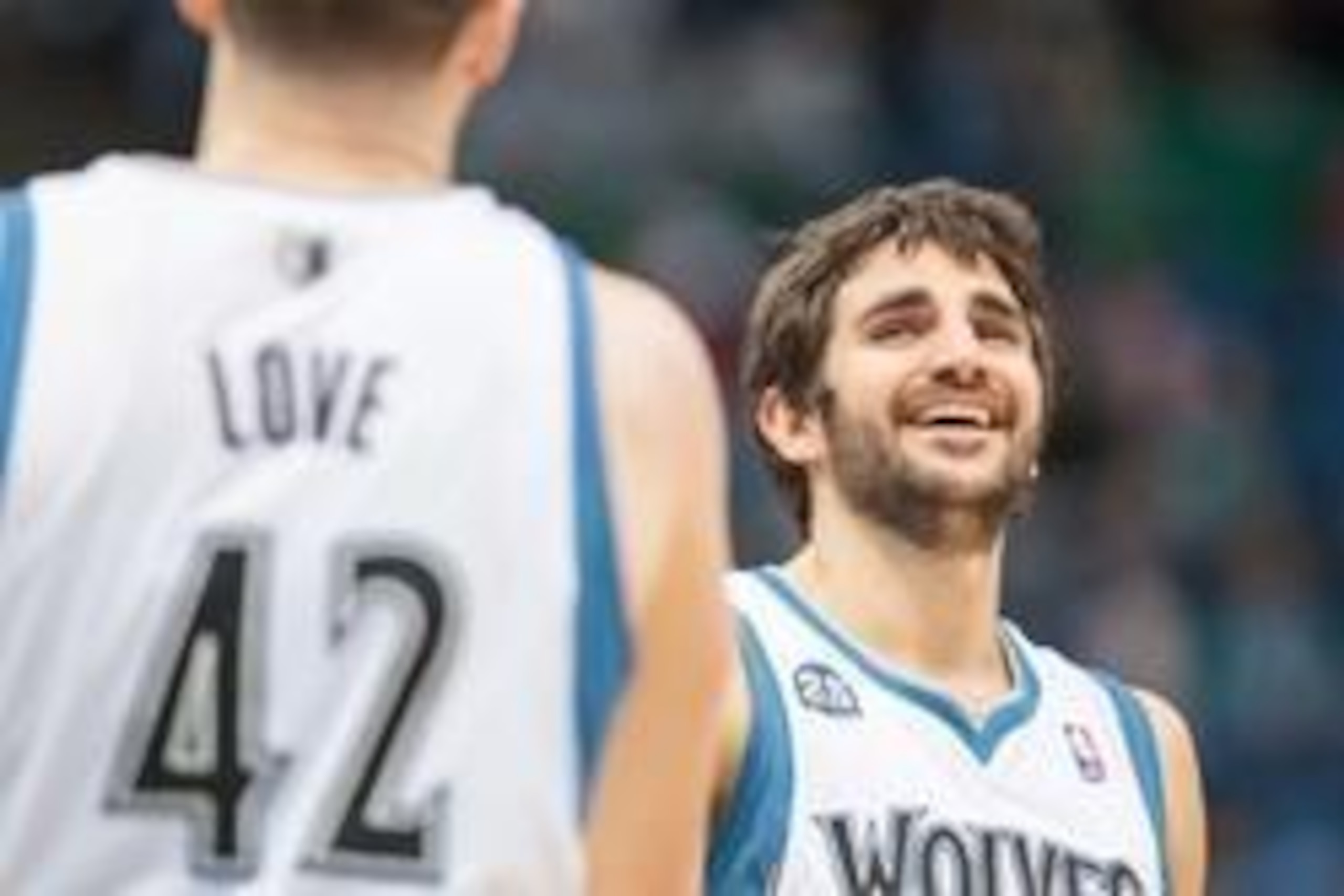 Apr 16, 2014; Minneapolis, MN, USA; Minnesota Timberwolves guard Ricky Rubio (9) smiles with forward Kevin Love (42) at Target Center. Mandatory Credit: Brad Rempel-USA TODAY Sports