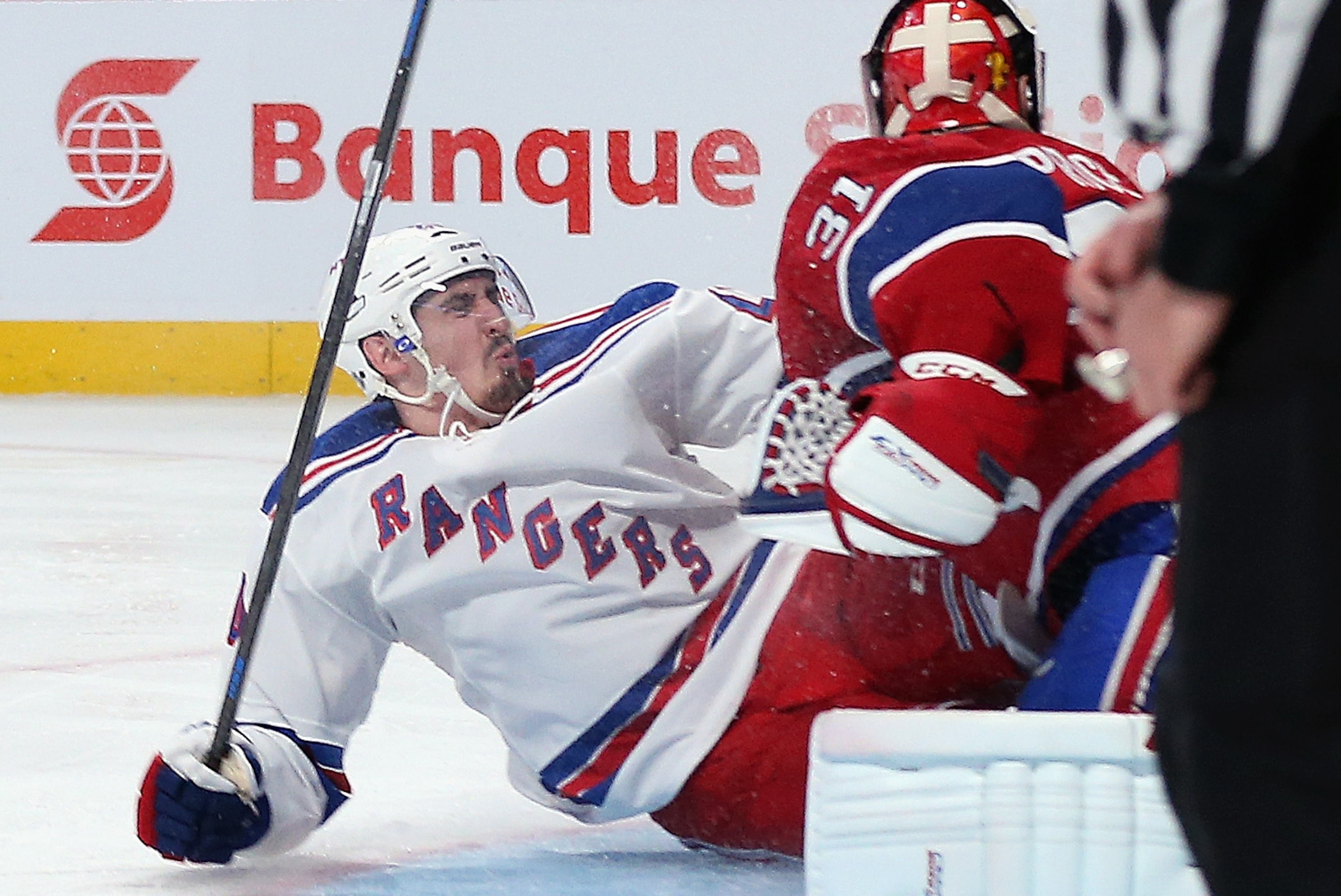 MONTREAL, QC - MAY 17:  Chris Kreider #20 of the New York Rangers slides into Carey Price #31 of the Montreal Canadiens during the second period in Game One of the Eastern Conference Final during the 2014 Stanley Cup Playoffs at the Bell Centre on May 17,
