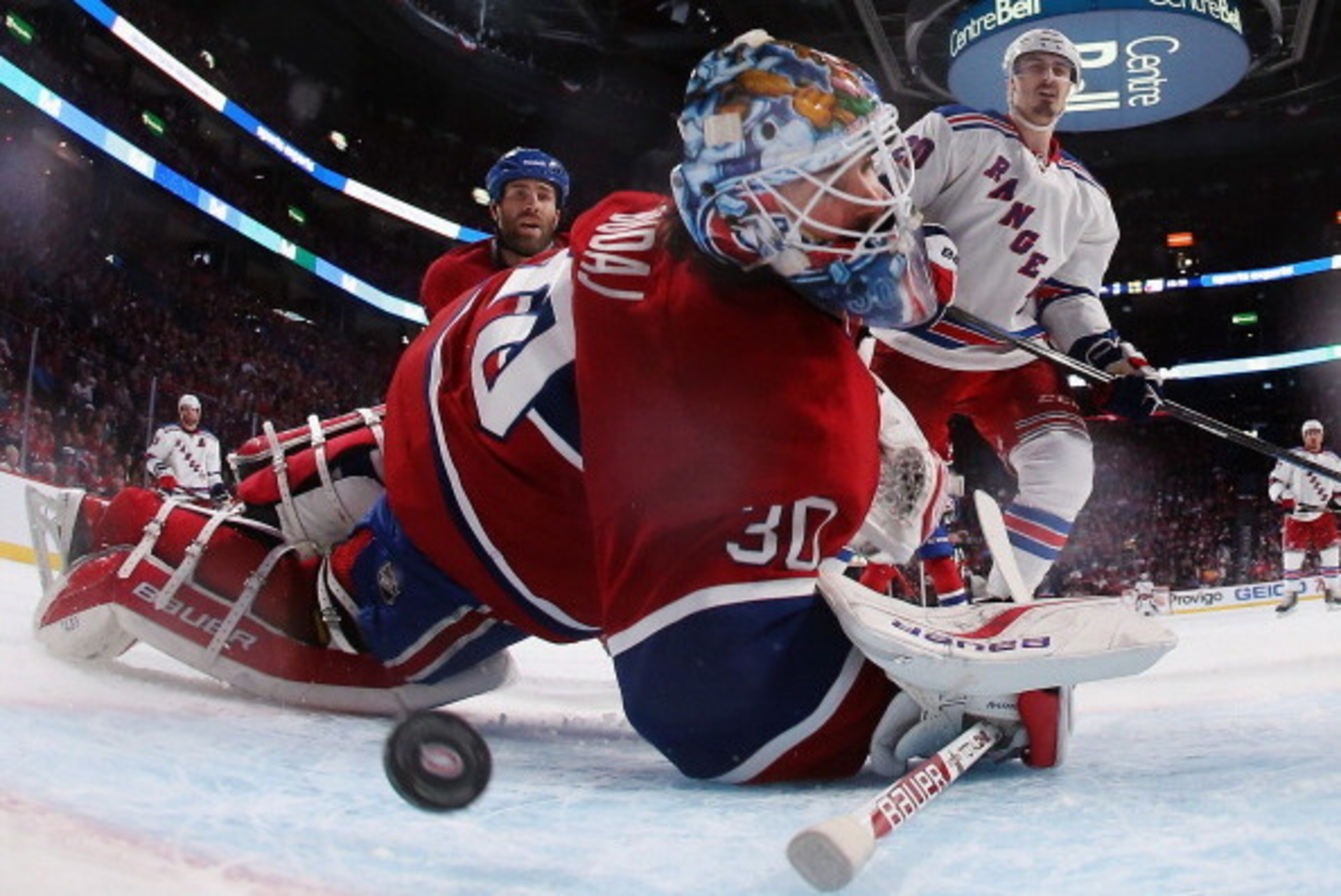 MONTREAL, QC - MAY 17:  Chris Kreider #20 of the New York Rangers watches a third period shot go past Peter Budaj #30 of the Montreal Canadiens in Game One of the Eastern Conference Final during the 2014 Stanley Cup Playoffs at the Bell Centre on May 17, 