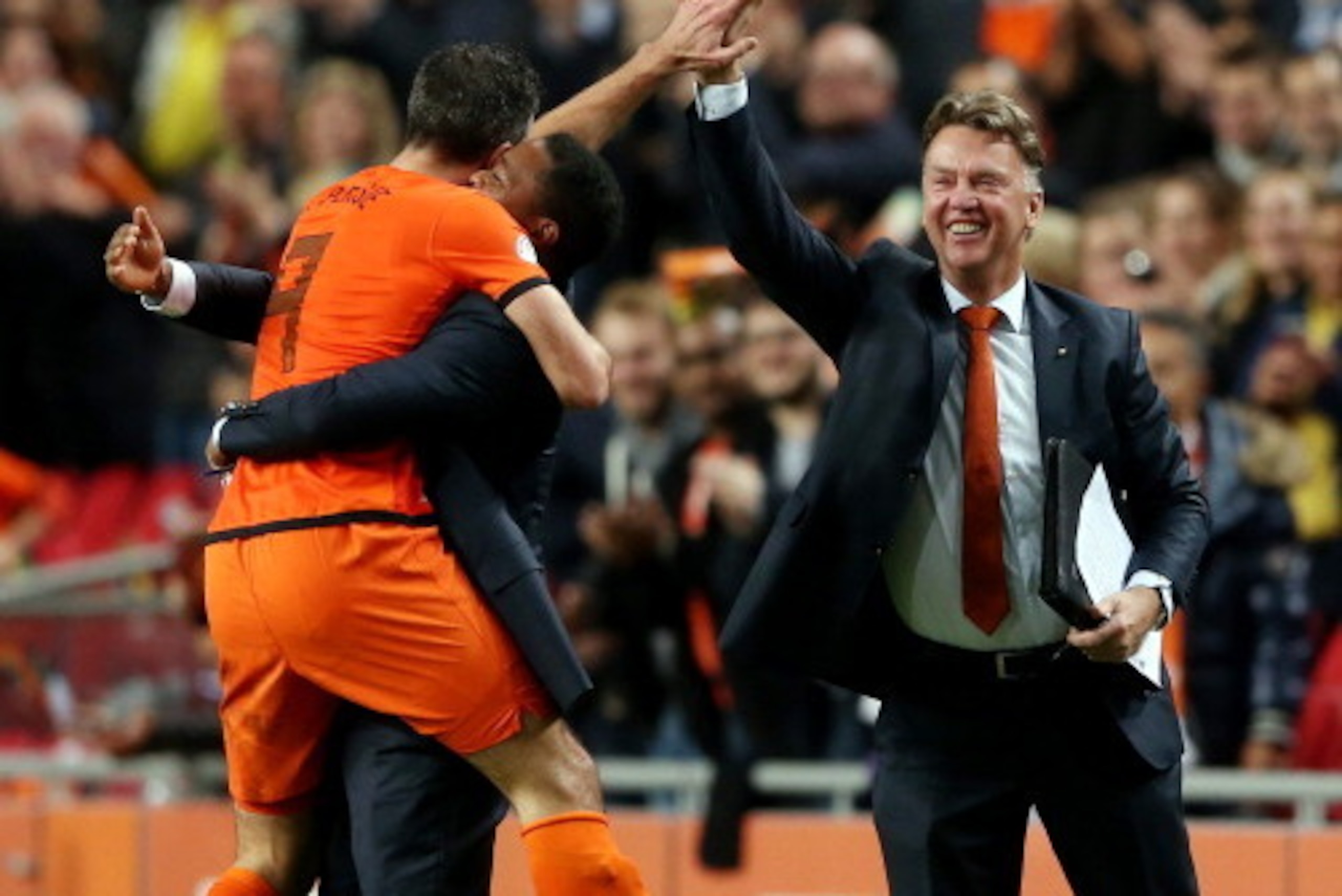 AMSTERDAM, NETHERLANDS - OCTOBER 11: Robin van Persie of Holland celebrates with Patrick Kluivert and manager Luis van Gaal after scoring their fourth goal during the FIFA 2014 World Cup Qualifing match between Holland and Hungary at Amsterdam Arena on O AMSTERDAM, NETHERLANDS - OCTOBER 11: Robin van Persie of Holland celebrates with Patrick Kluivert and manager Luis van Gaal after scoring their fourth goal during the FIFA 2014 World Cup Qualifing match between Holland and Hungary at Amsterdam Arena on O