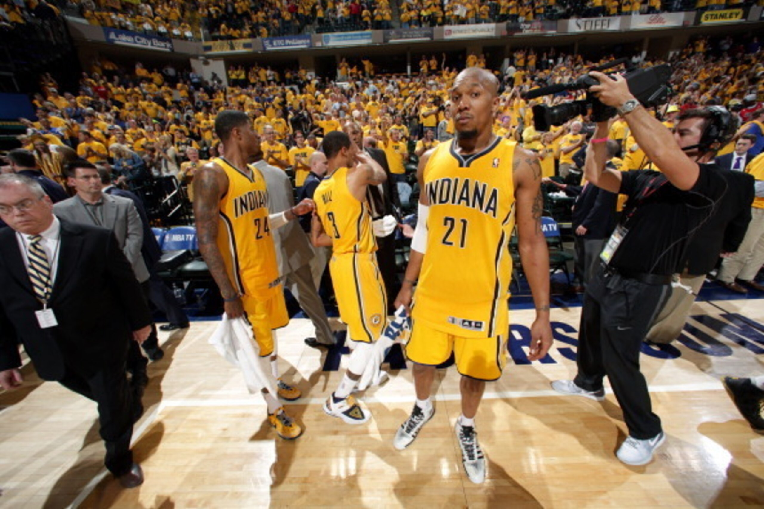 INDIANAPOLIS - MAY 18: David West #21, Paul George #24, and George Hill #3 of the Indiana Pacers celebrate after a game against the Miami Heat in game one of the East Conference Finals at Bankers Life Fieldhouse on May 18, 2014 in Indianapolis, Indiana.  
