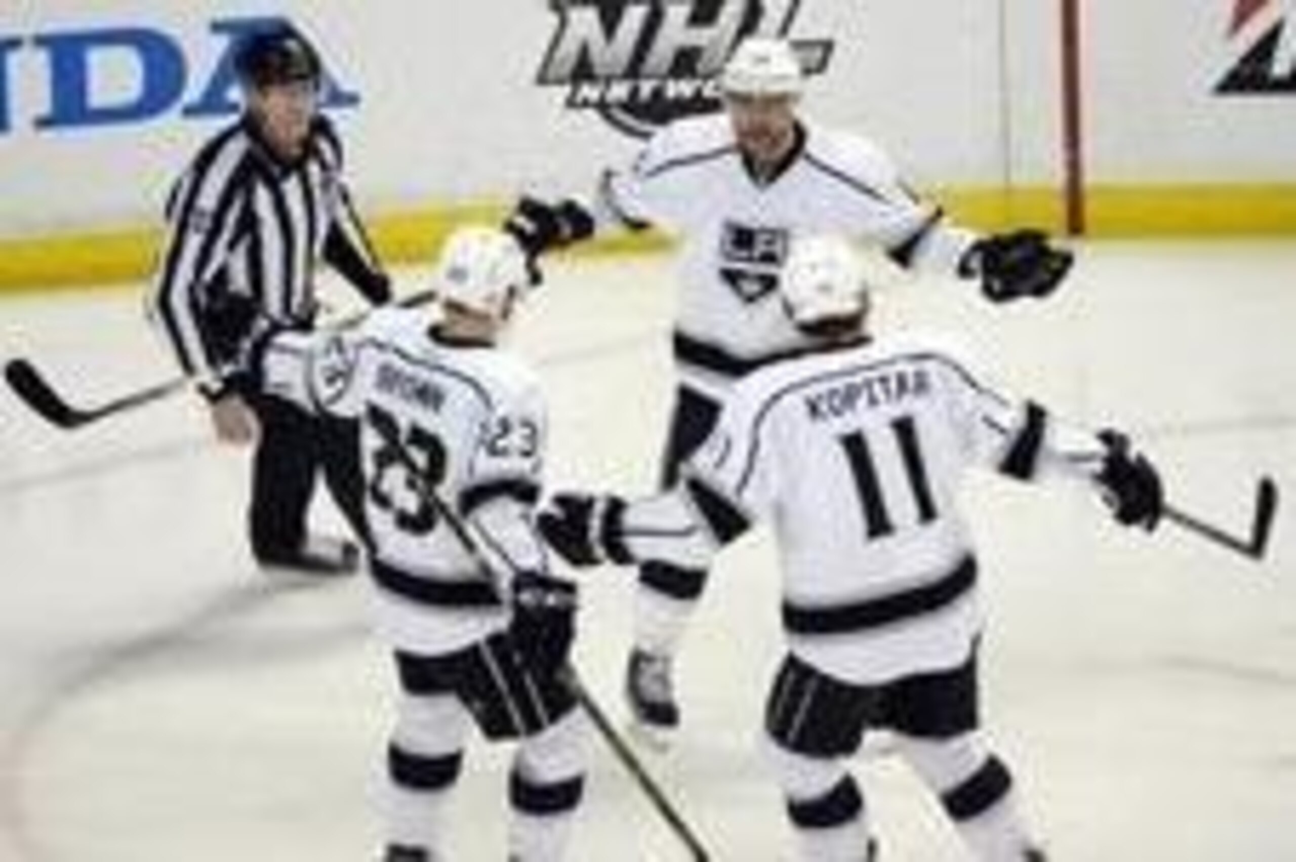May 5, 2014; Anaheim, CA, USA; Los Angeles Kings right wing Marian Gaborik (12) celebrates with teammates Anze Kopitar (11) and Dustin Brown (23) after scoring a goal against the Anaheim Ducks during the first period in game two of the second round of the