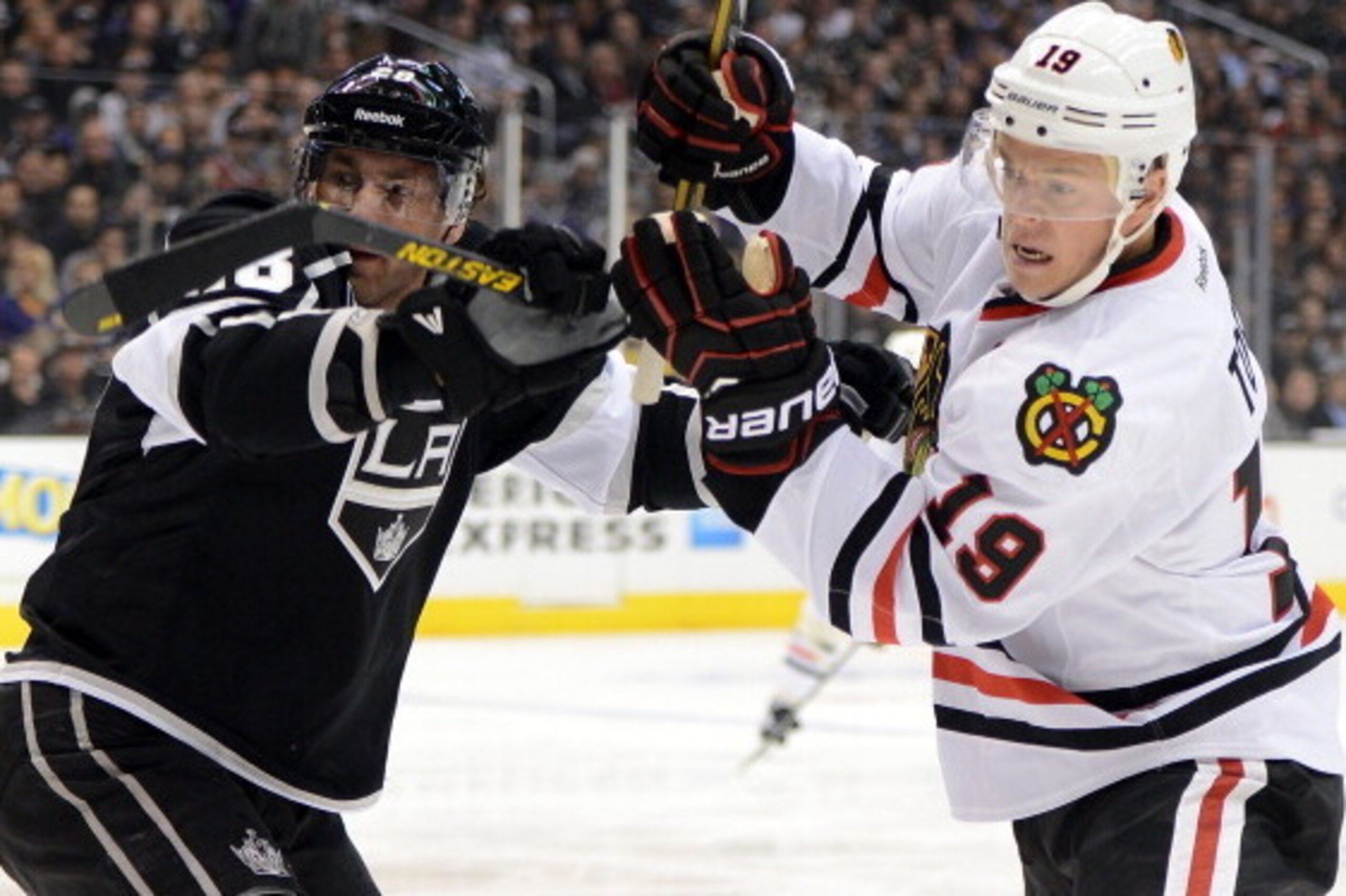 LOS ANGELES, CA - JANUARY 19:  Jonathan Toews #19 of the Chicago Blackhawks and Jarret Stoll #28 of the Los Angeles Kings fight for position during the game at Staples Center on January 19, 2013 in Los Angeles, California.  (Photo by Harry How/Getty Image