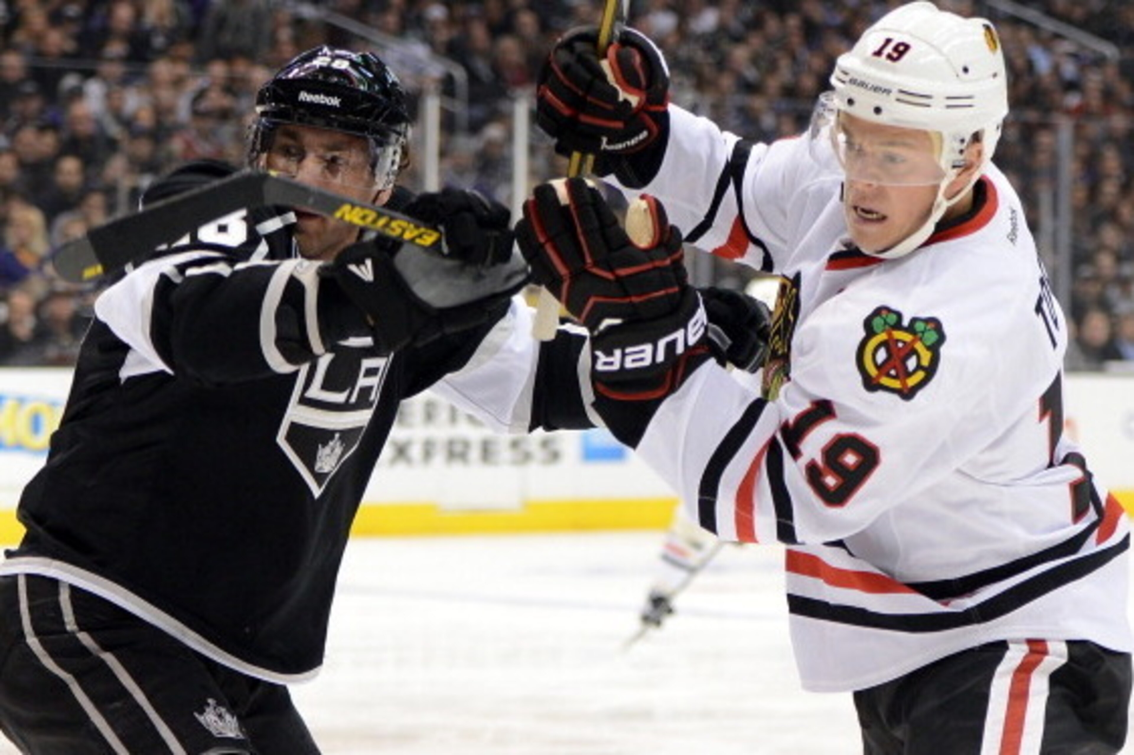 LOS ANGELES, CA - JANUARY 19:  Jonathan Toews #19 of the Chicago Blackhawks and Jarret Stoll #28 of the Los Angeles Kings fight for position during the game at Staples Center on January 19, 2013 in Los Angeles, California.  (Photo by Harry How/Getty Image