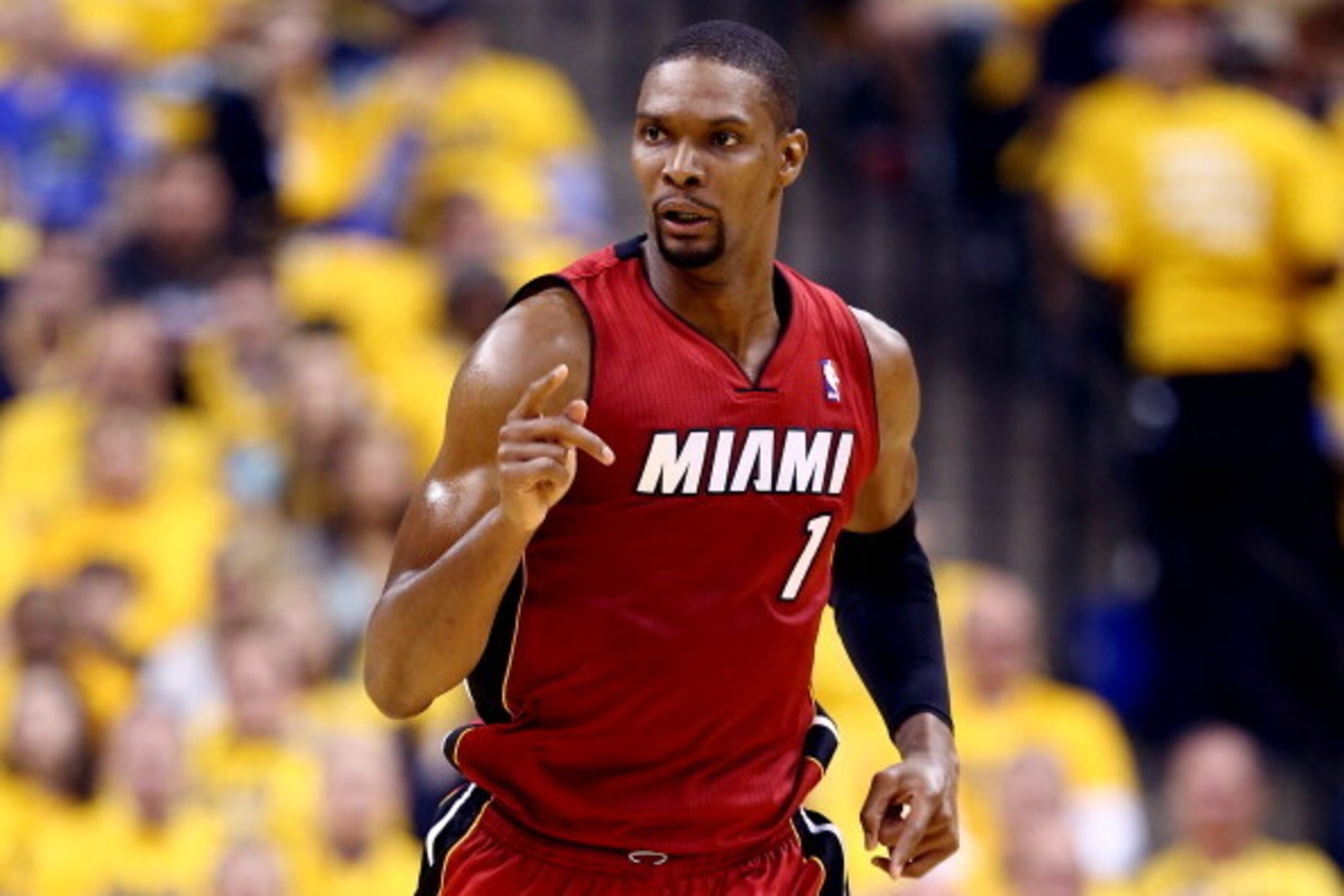 INDIANAPOLIS, IN - MAY 18: Chris Bosh #1 of the Miami Heat reacts against the Indiana Pacers during Game One of the Eastern Conference Finals of the 2014 NBA Playoffs at Bankers Life Fieldhouse on May 18, 2014 in Indianapolis, Indiana. NOTE TO USER: User INDIANAPOLIS, IN - MAY 18: Chris Bosh #1 of the Miami Heat reacts against the Indiana Pacers during Game One of the Eastern Conference Finals of the 2014 NBA Playoffs at Bankers Life Fieldhouse on May 18, 2014 in Indianapolis, Indiana. NOTE TO USER: User