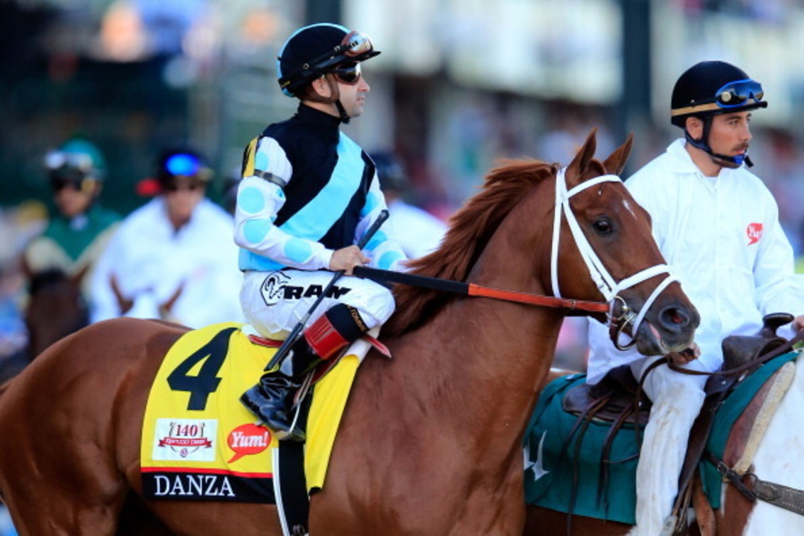 LOUISVILLE, KY - MAY 03:  Danza #4, ridden by Joe Bravo, takes part in the post parade prior the 140th running of the Kentucky Derby at Churchill Downs on May 3, 2014 in Louisville, Kentucky.  (Photo by Rob Carr/Getty Images)