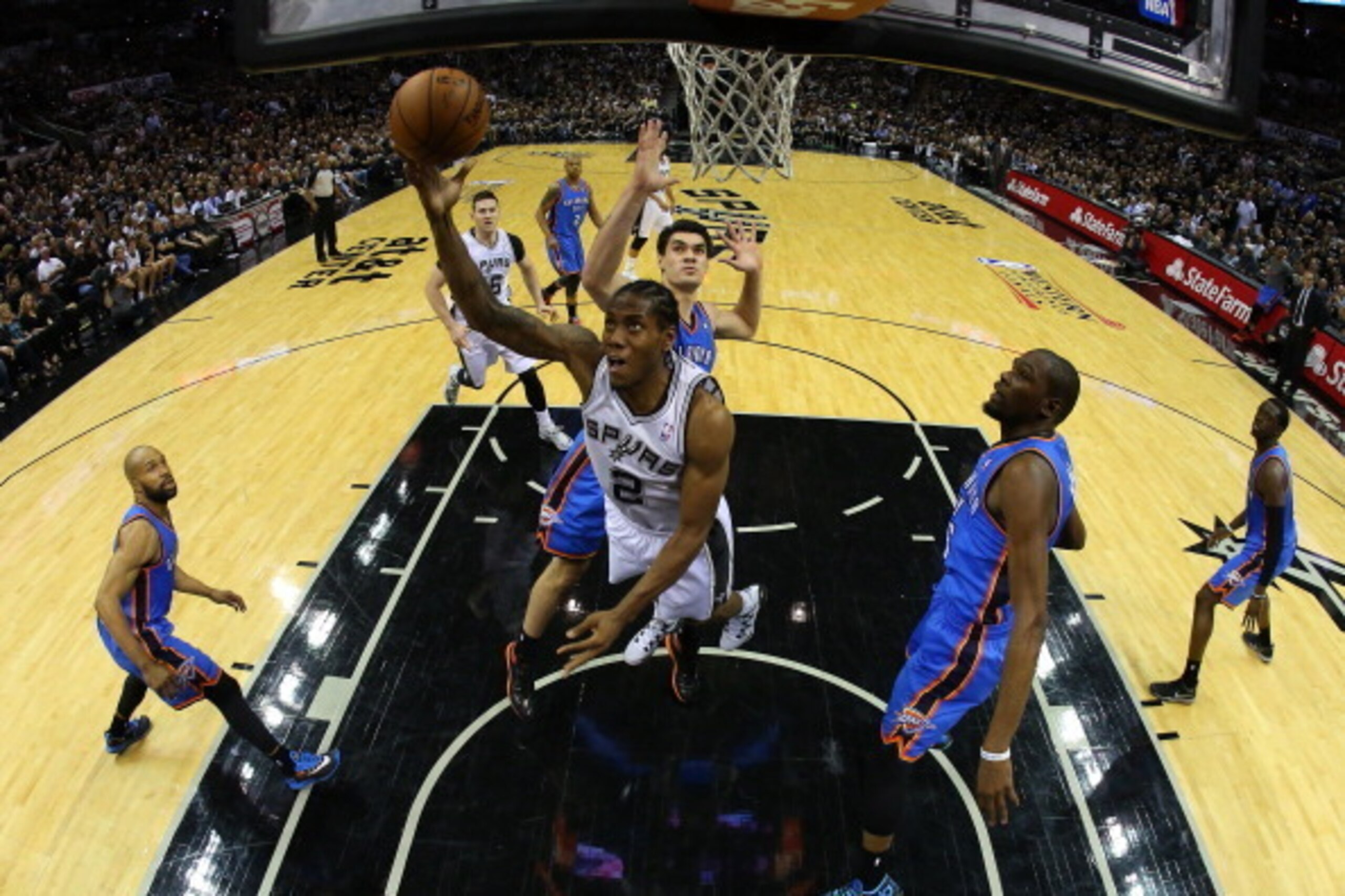 SAN ANTONIO, TX - MAY 19:  Kawhi Leonard #2 of the San Antonio Spurs goes up for a shot against Steven Adams #12 of the Oklahoma City Thunder in the fourth quarter in Game One of the Western Conference Finals during the 2014 NBA Playoffs at AT&T Center on