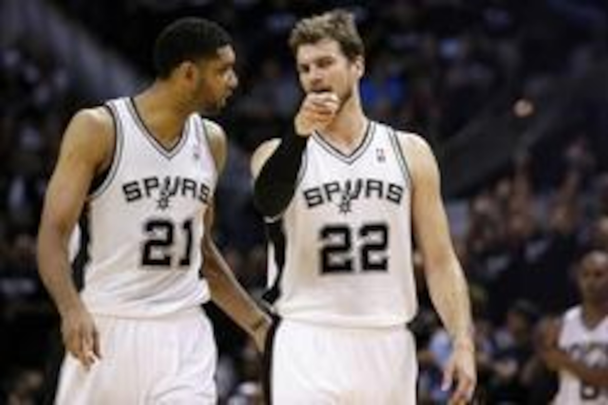May 19, 2014; San Antonio, TX, USA; San Antonio San Antonio Spurs forward Tiago Splitter (22) and forward Tim Duncan (21) walk onto the court after a timeout in game one of the Western Conference Finals in the 2014 NBA Playoffs against the Oklahoma City T