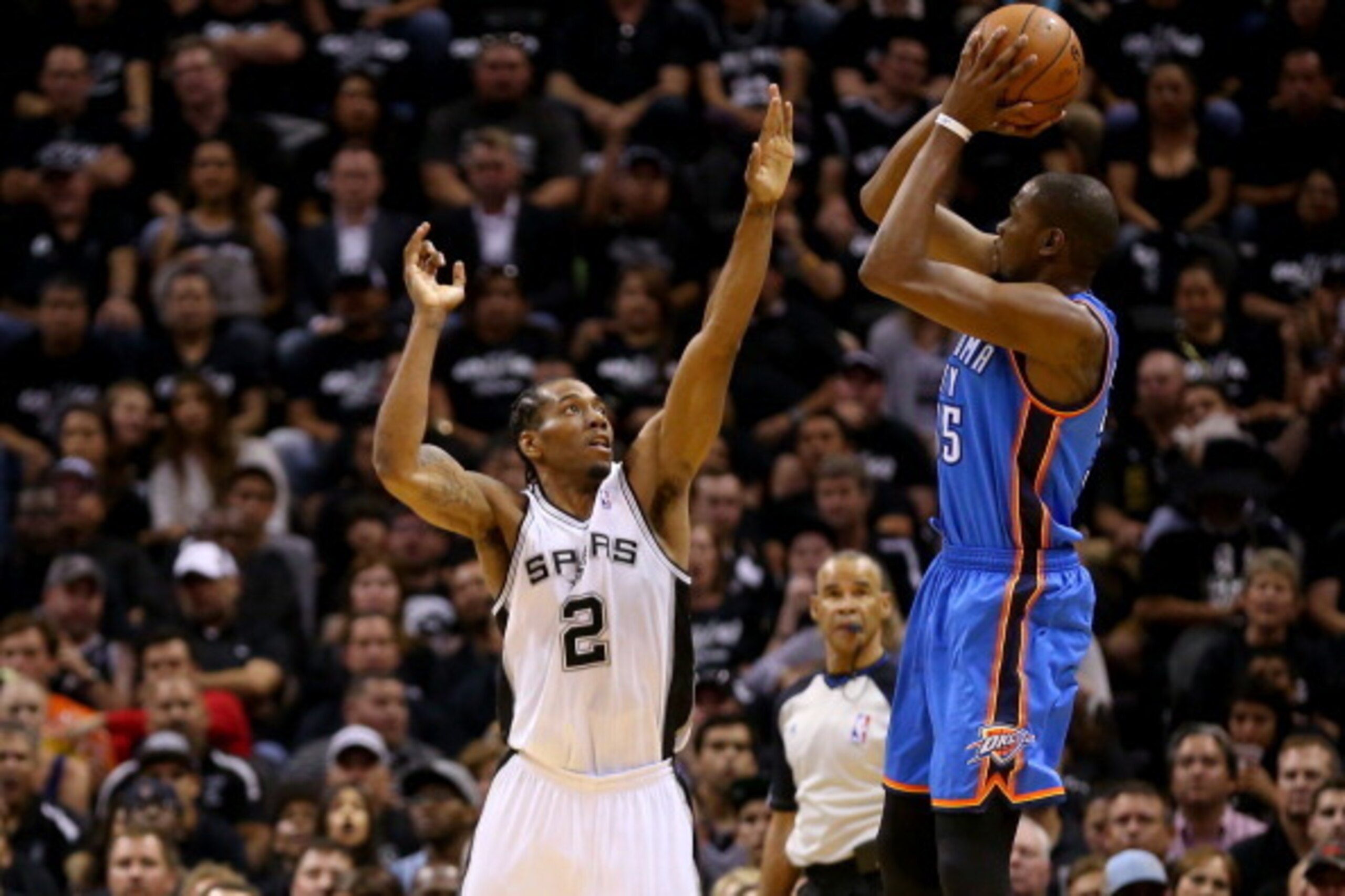SAN ANTONIO, TX - MAY 19:  Kevin Durant #35 of the Oklahoma City Thunder shoots over Kawhi Leonard #2 of the San Antonio Spurs in the first quarter in Game One of the Western Conference Finals during the 2014 NBA Playoffs at AT&T Center on May 19, 2014 in