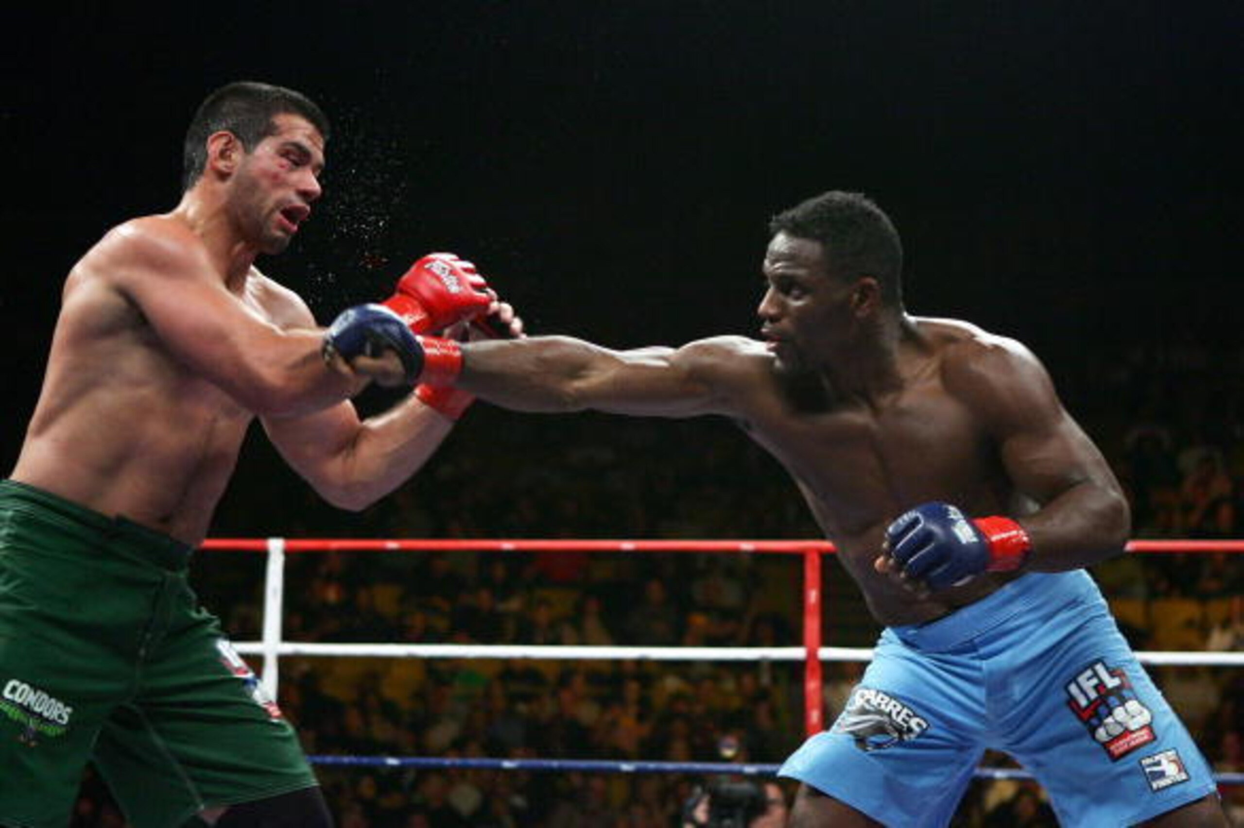 INGLEWOOD, CA - MARCH 17:  Antonio McKee (blue trunks)throws a right punch to Rodrigo Ruas of Team Condors (green trunks ) during the International Fighting League at The Forum on March 17, 2007 in Inglewood, California.  (Photo by Jeff Gross/Getty Images