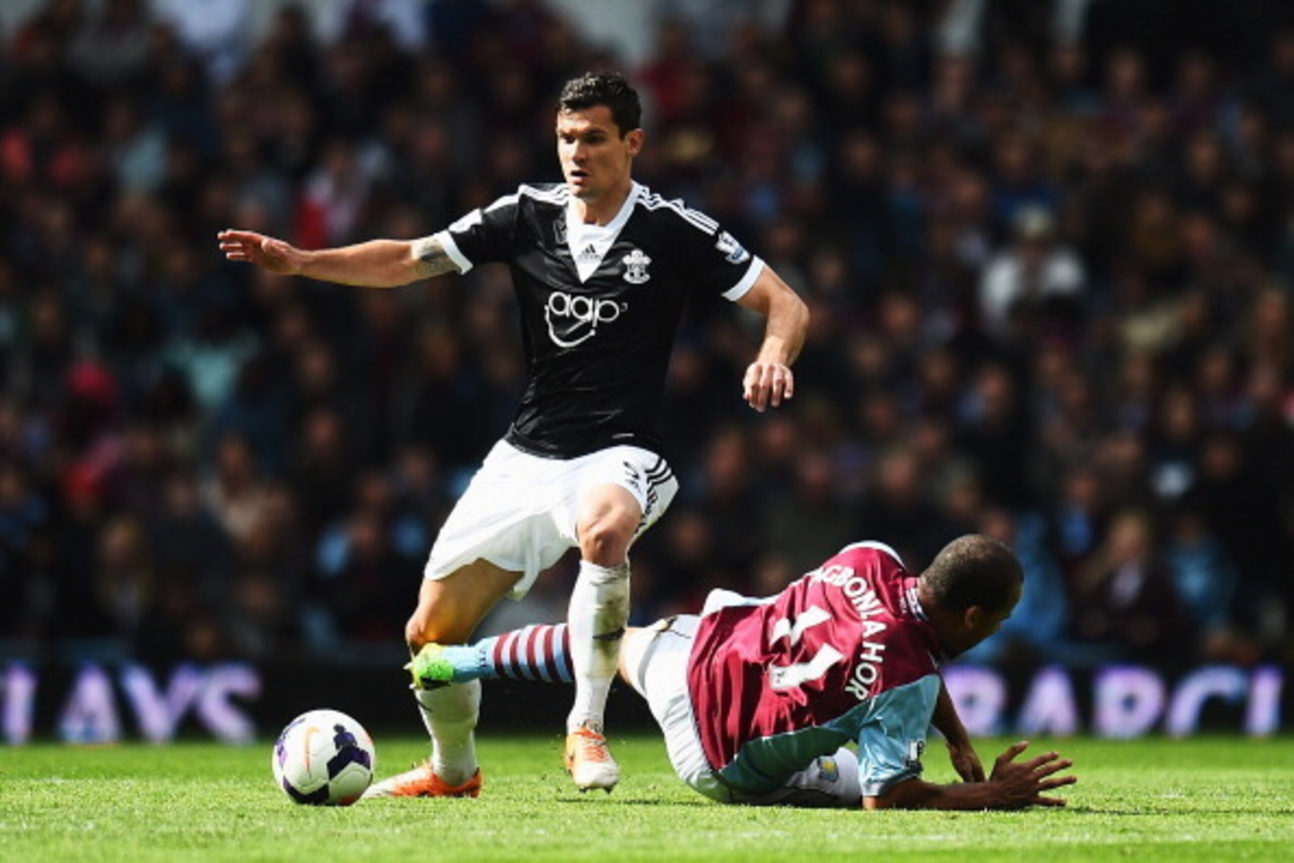 BIRMINGHAM, ENGLAND - APRIL 19:  (L-R) Dejan Lovren of Southampton is challenged by Gabriel Agbonlahor of Aston Villa during the Barclays Premier League match between Aston Villa and Southampton at Villa Park on April 19, 2014 in Birmingham, England.  (Ph