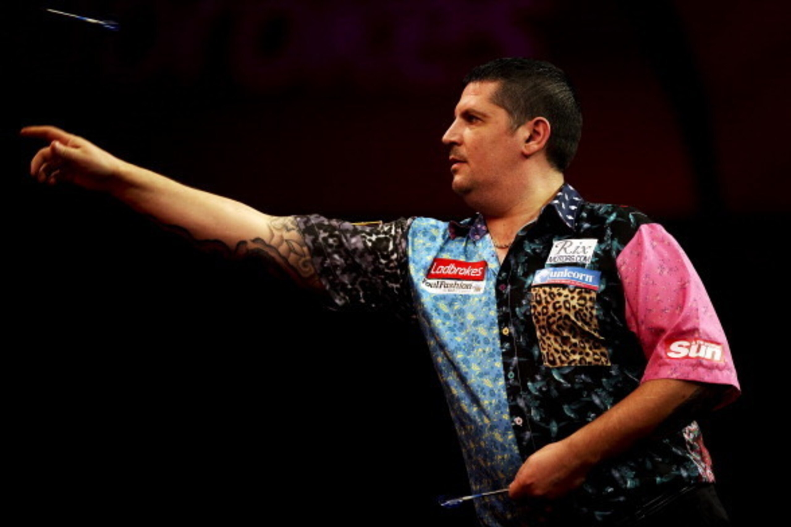 LONDON, ENGLAND - DECEMBER 27: Gary Anderson of Scotland in action during his third round match against Raymond van Barneveld on day eleven of the 2013 Ladbrokes.com World Darts Championship at the Alexandra Palace on December 27, 2012 in London, England.