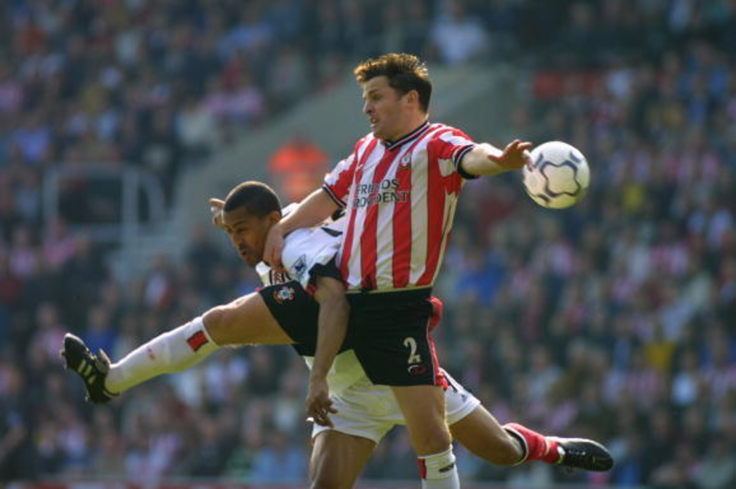 30 Mar 2002: Steve Marlet of Fulham is challenged in the air by Jason Dodd of Southampton during the FA Barclaycard Premiership match between Southampton and Fulham at the Friend's Provident St Mary's Stadium in Southampton, England. DIGITAL IMAGE \ Mand 30 Mar 2002: Steve Marlet of Fulham is challenged in the air by Jason Dodd of Southampton during the FA Barclaycard Premiership match between Southampton and Fulham at the Friend's Provident St Mary's Stadium in Southampton, England. DIGITAL IMAGE \ Mand