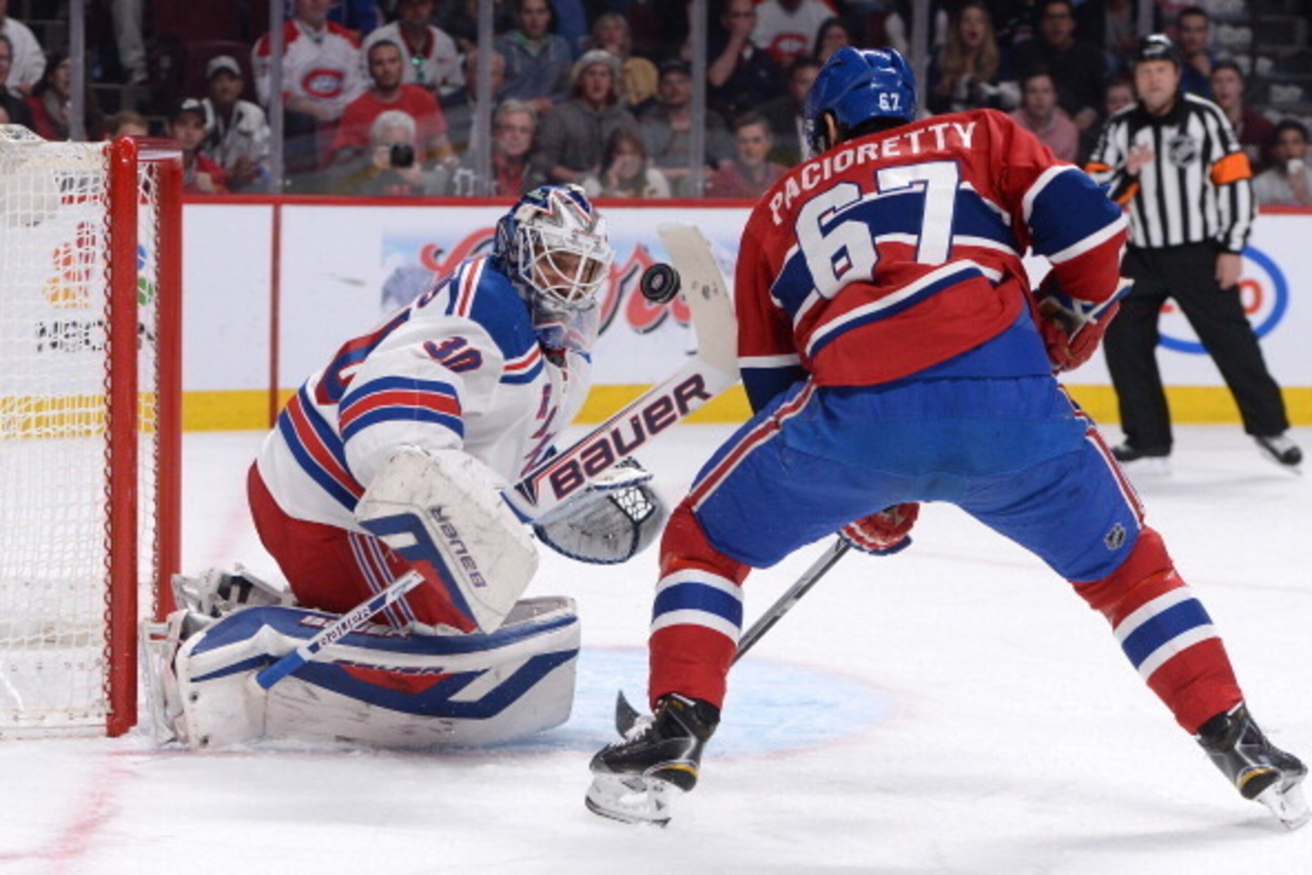MONTREAL, QC - MAY 19:  Henrik Lundqvist #30 of the New York Rangers blocks the shot by Max Pacioretty #67 of the Montreal Canadiens  in Game Two of the Eastern Conference Final during the 2014 NHL Stanley Cup Playoffs at the Bell Centre on May 19, 2014 i