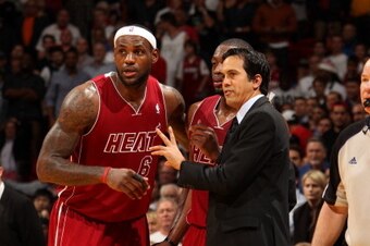 MIAMI, FL - DECEMBER 18: Erik Spoelstra of the Miami Heat shares a word with LeBron James #6 during the game the game against the Indiana Pacers on December 18, 2013 at American Airlines Arena in Miami, Florida. NOTE TO USER: User expressly acknowledges a