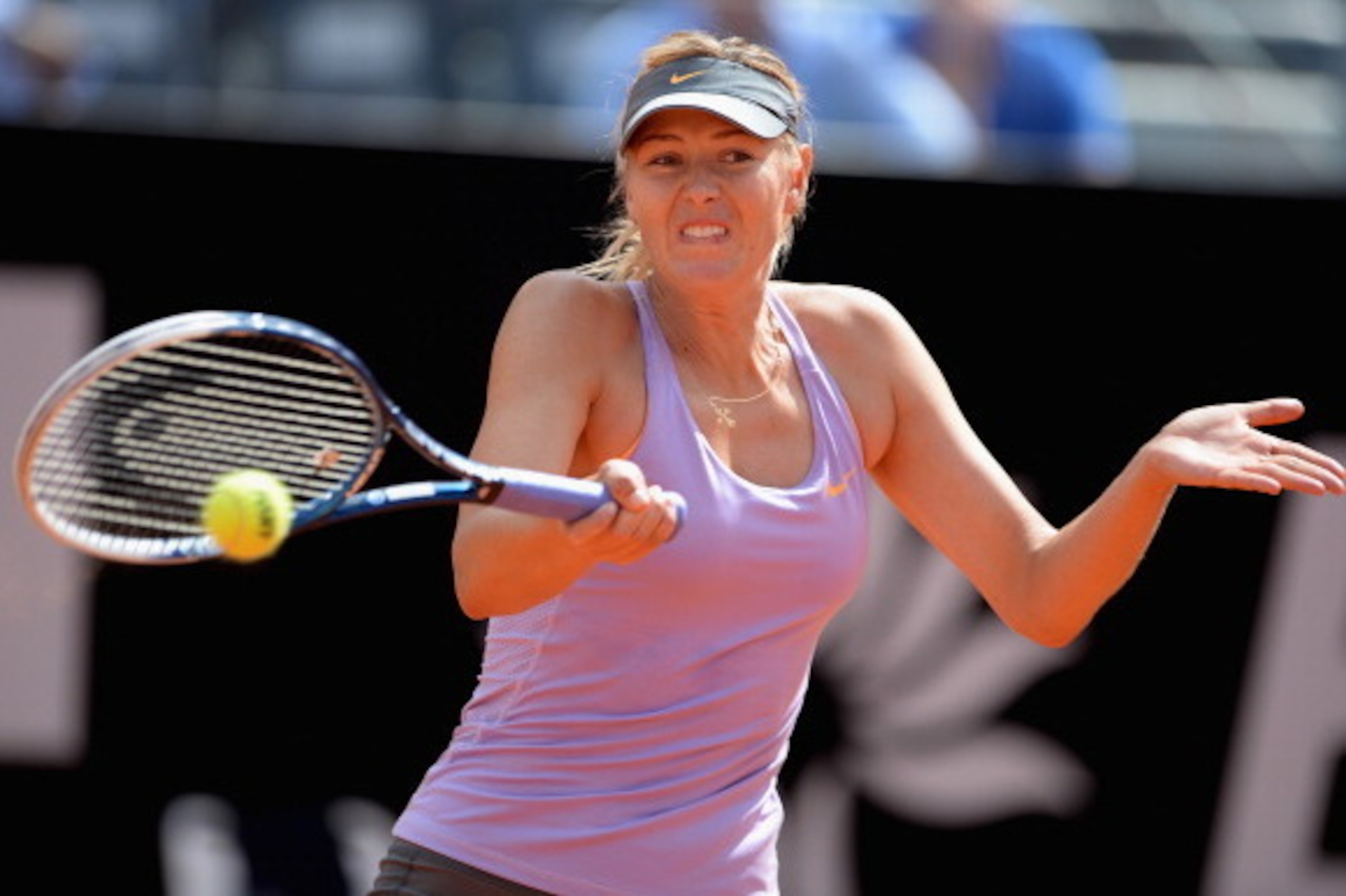 ROME, ITALY - MAY 15:  Maria Sharapova of Russia in action during her game against Ana Ivanovic of Serbia during day 5 of the Internazionali BNL d'Italia 2014 on May 15, 2014 in Rome, Italy.  (Photo by Michael Regan/Getty Images)