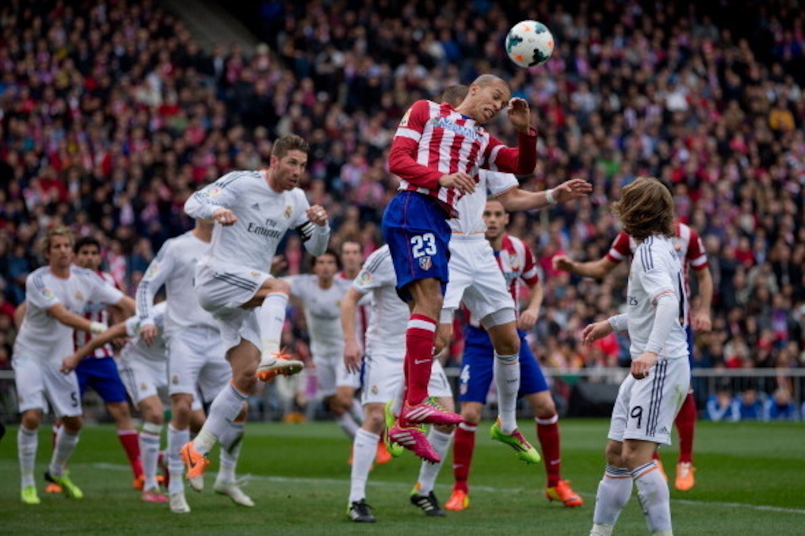 MADRID, SPAIN - MARCH 02: Joao Miranda of Atletico de Madrid wins the header after Karim Benzema of Real Madrid CF during the La Liga match between Club Atletico de Madrid and Real Madrid CF at Vicente Calderon Stadium on March 2, 2014 in Madrid, Spain.  