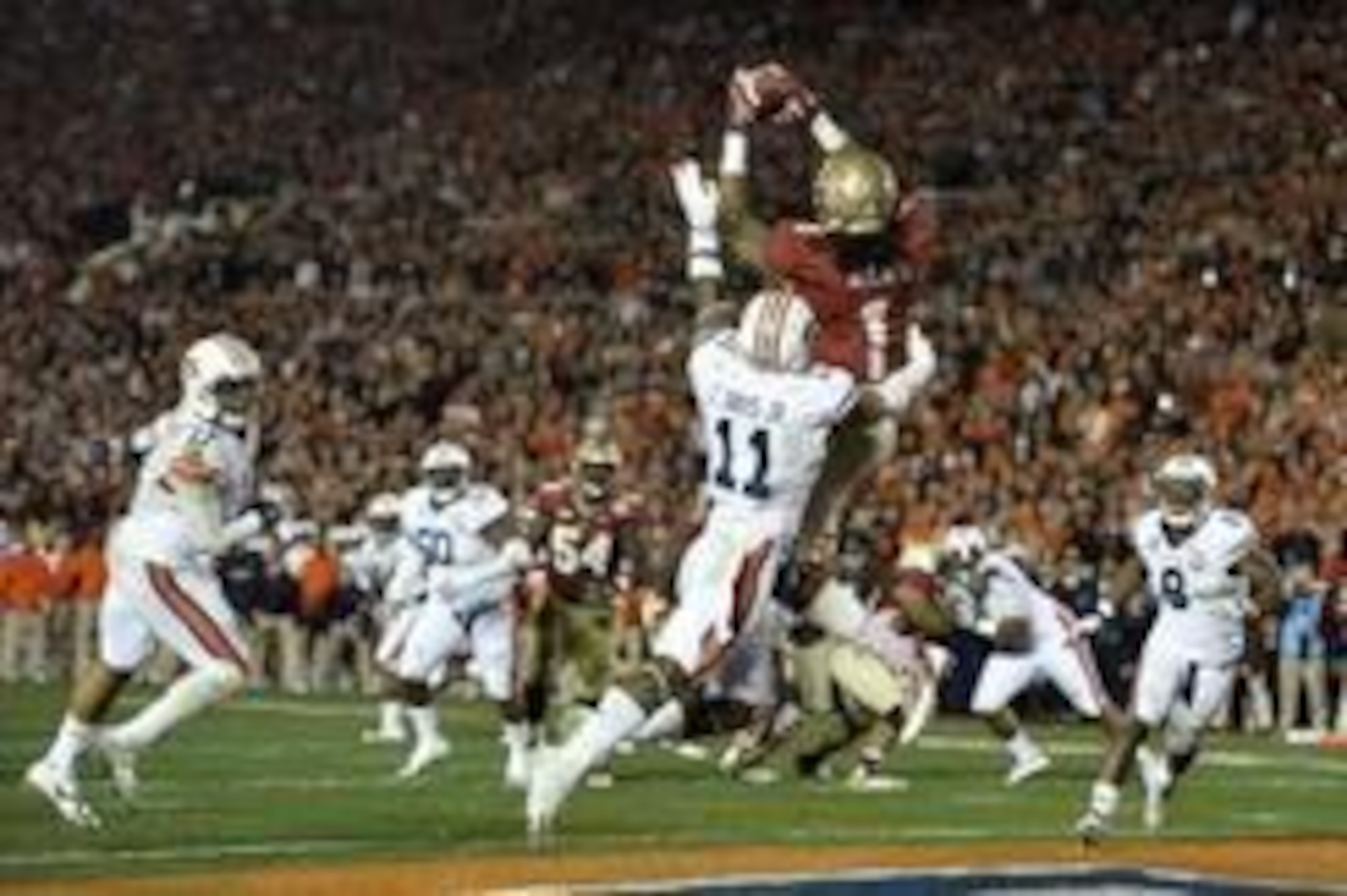 Jan 6, 2014; Pasadena, CA, USA; Florida State Seminoles wide receiver Kelvin Benjamin (1) catches a touchdown pass over Auburn Tigers cornerback Chris Davis (11) during the second half of the 2014 BCS National Championship game at the Rose Bowl.  Mandator