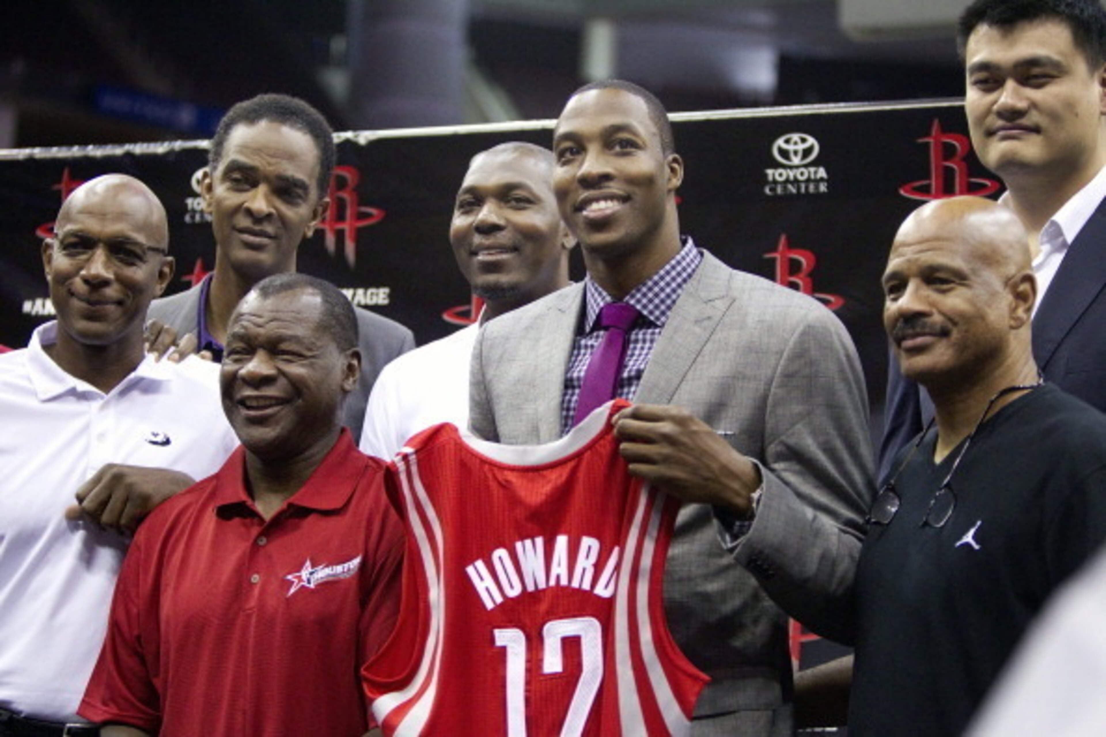 HOUSTON - JULY 13:  Dwight Howard (3R) stands with former Houston Rockets former players (L-R) Clyde Drexler, Ralph Sampson, Calvin Murphy, Hakeem Olajuwon, Yao Ming and John Lucas during a press conference on July 13, 2013 in Houston, Texas.  (Photo by B