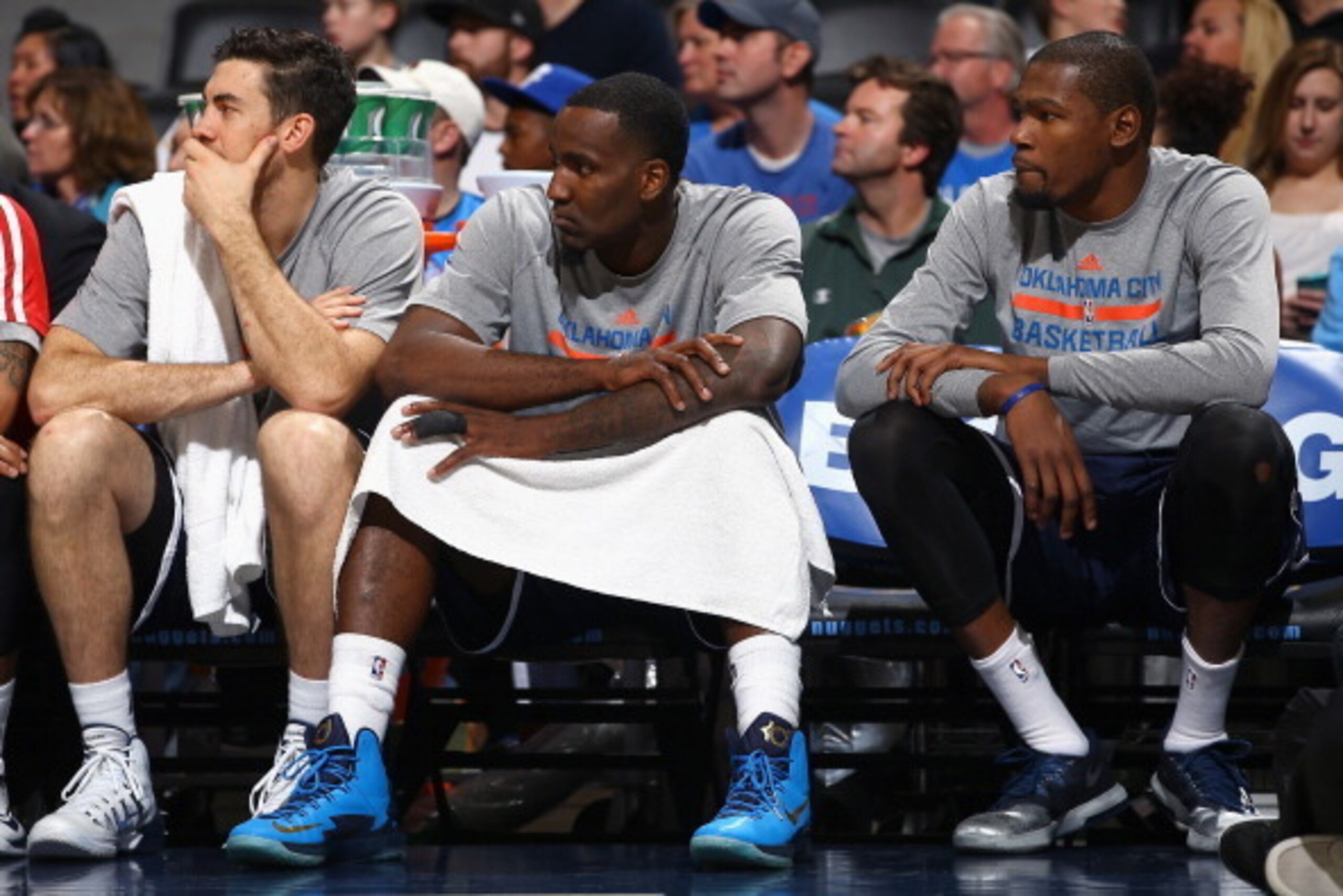 DENVER, CO - JANUARY 09:  (L-R) Nick Collison #4, Kendrick Perkins #5 and Kevin Durant #35 of the Oklahoma City Thunder sit on the bench in the fourth quarter against the Denver Nuggets at Pepsi Center on January 9, 2014 in Denver, Colorado. The Nuggets d