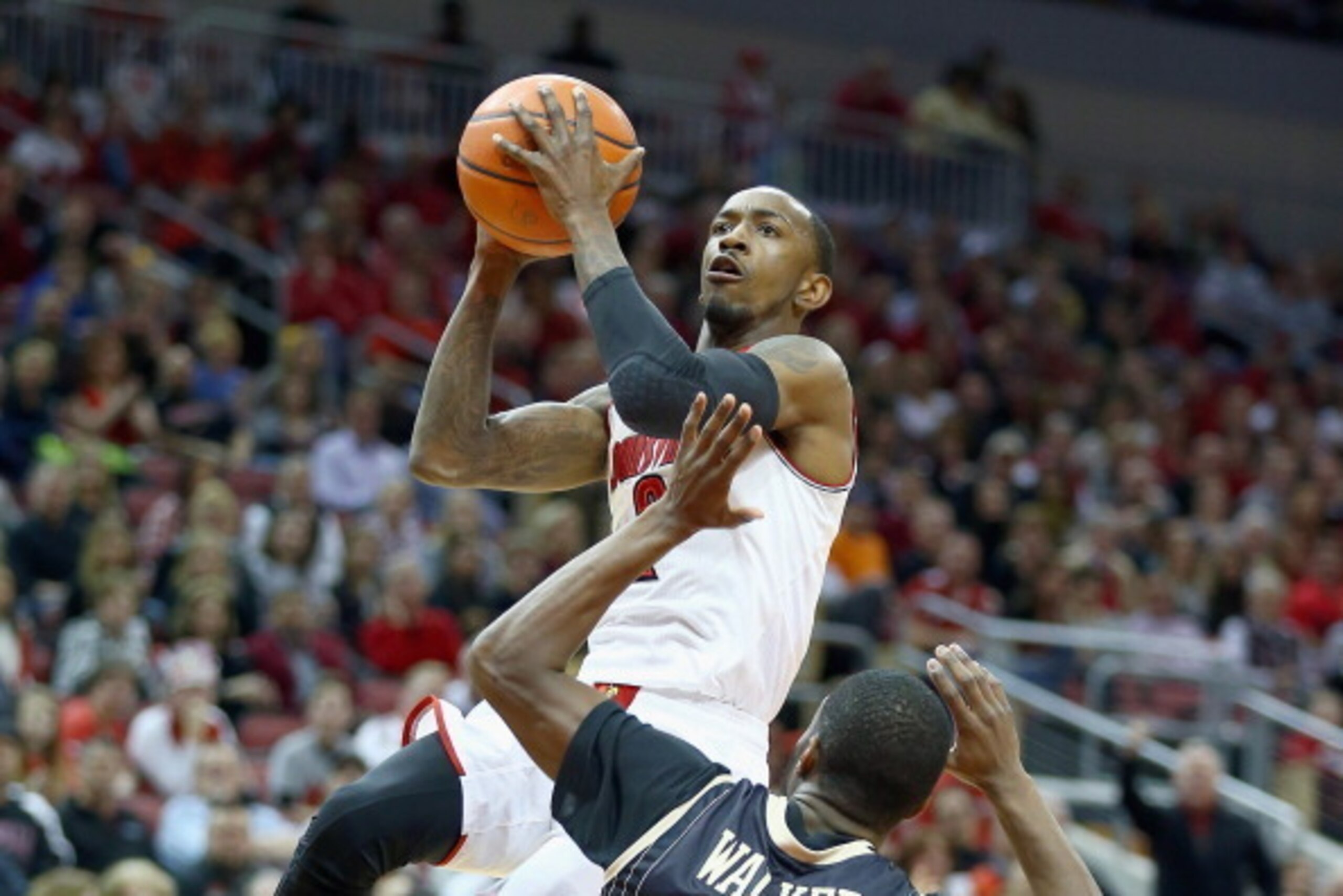 LOUISVILLE, KY - FEBRUARY 01:  Russ Smith #2 of the Louisville Cardinals shoots the ball during the game against the Central Florida Knights at KFC YUM! Center on February 1, 2014 in Louisville, Kentucky.  (Photo by Andy Lyons/Getty Images)