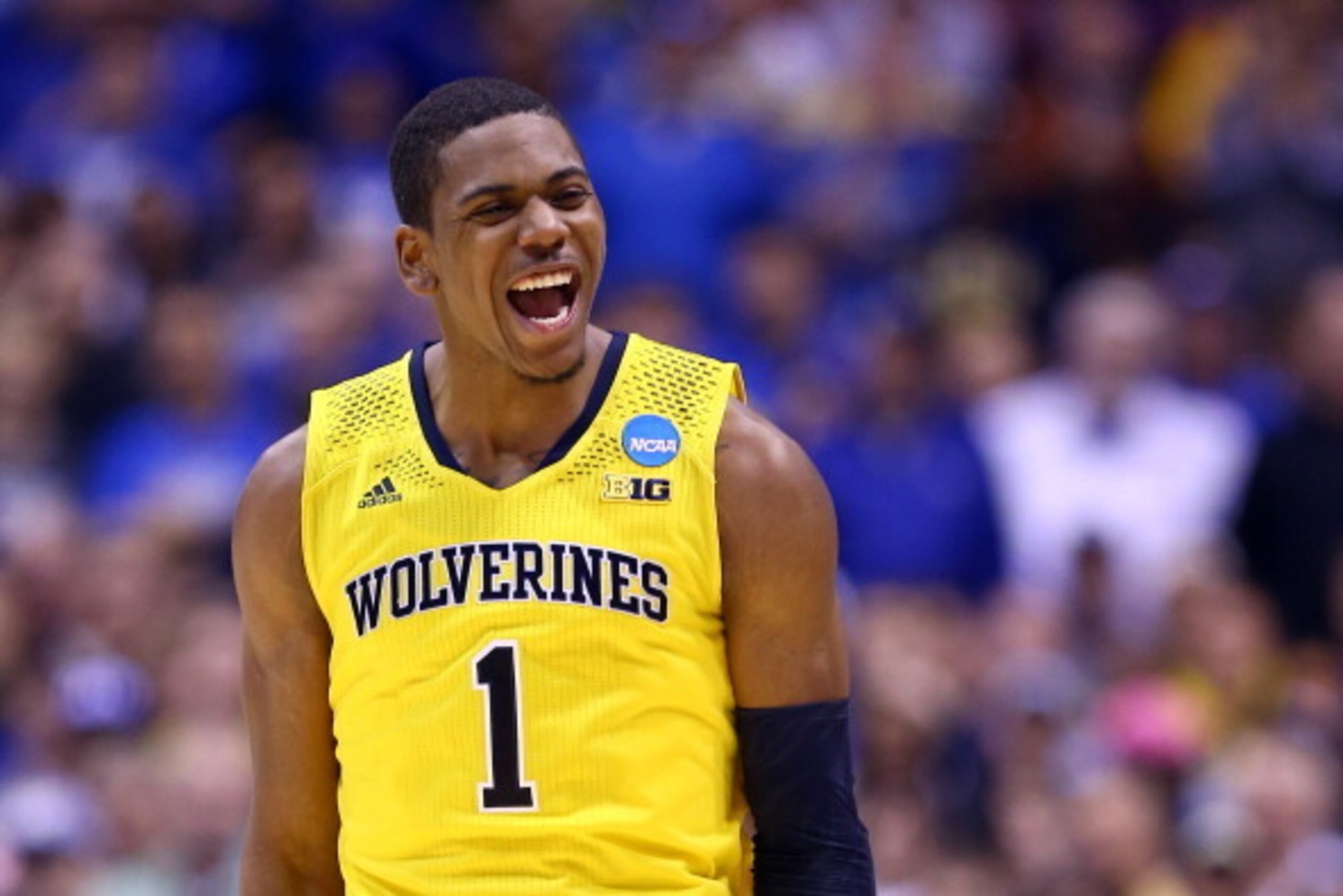 INDIANAPOLIS, IN - MARCH 30:  Glenn Robinson III #1 of the Michigan Wolverines celebrates after a basket in the second half against the Kentucky Wildcats during the midwest regional final of the 2014 NCAA Men's Basketball Tournament at Lucas Oil Stadium o
