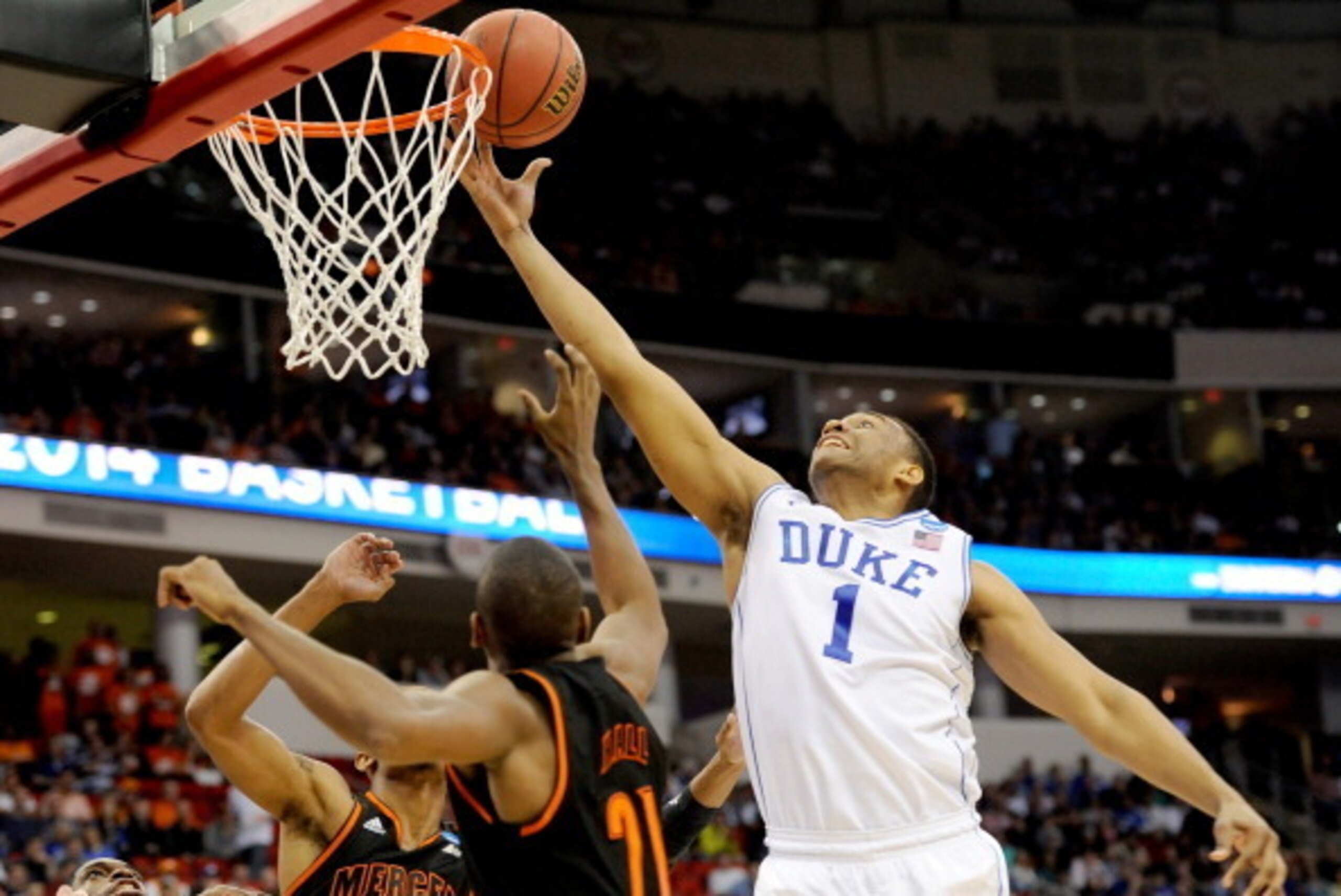 RALEIGH, NC - MARCH 21:  Jabari Parker #1 of the Duke Blue Devils goes up for the ball against Langston Hall #21 of the Mercer Bears in the first half in the second round of the 2014 NCAA Men's Basketball Tournament at PNC Arena on March 21, 2014 in Ralei