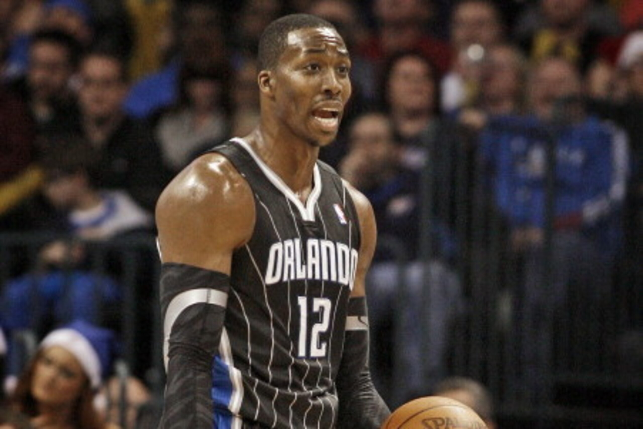 OKLAHOMA CITY, OK - DECEMBER 25:  Dwight Howard #12 of the Orlando Magic questions a call during the NBA season opening game against the Oklahoma City Thunder December 25, 2011 at the Chesapeake Energy Arena in Oklahoma City, Oklahoma.  Oklahoma City defe