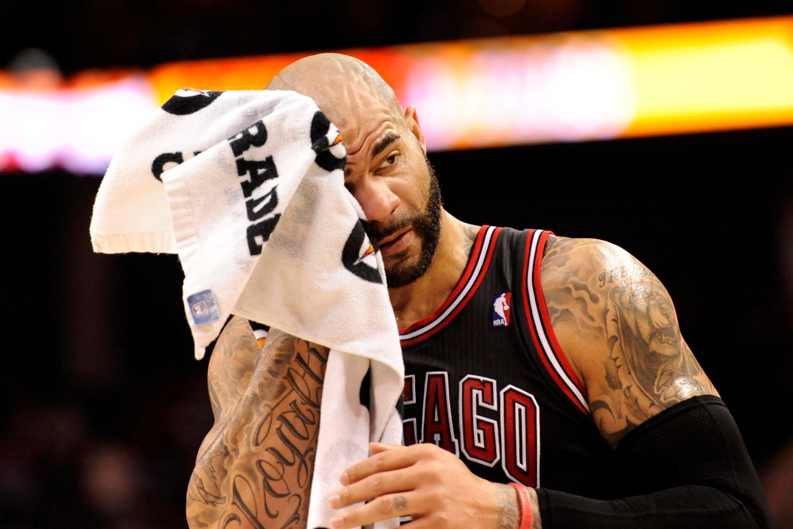 Apr 16, 2014; Charlotte, NC, USA; Chicago Bulls forward Carlos Boozer (5) wipes his head during a time out during the first half of the game against the Charlotte Bobcats at Time Warner Cable Arena. Mandatory Credit: Sam Sharpe-USA TODAY Sports