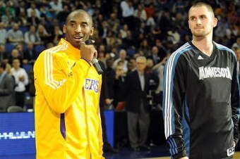 LONDON, ENGLAND - OCTOBER 4:   Kobe Bryant #24 of the Los Angeles Lakers and Kevin Love #42 of the Minnesota Timberwolves talk to the crowd at The O2 arena on October 4, 2010 in London, England. NOTE TO USER: User expressly acknowledges and agrees that, b