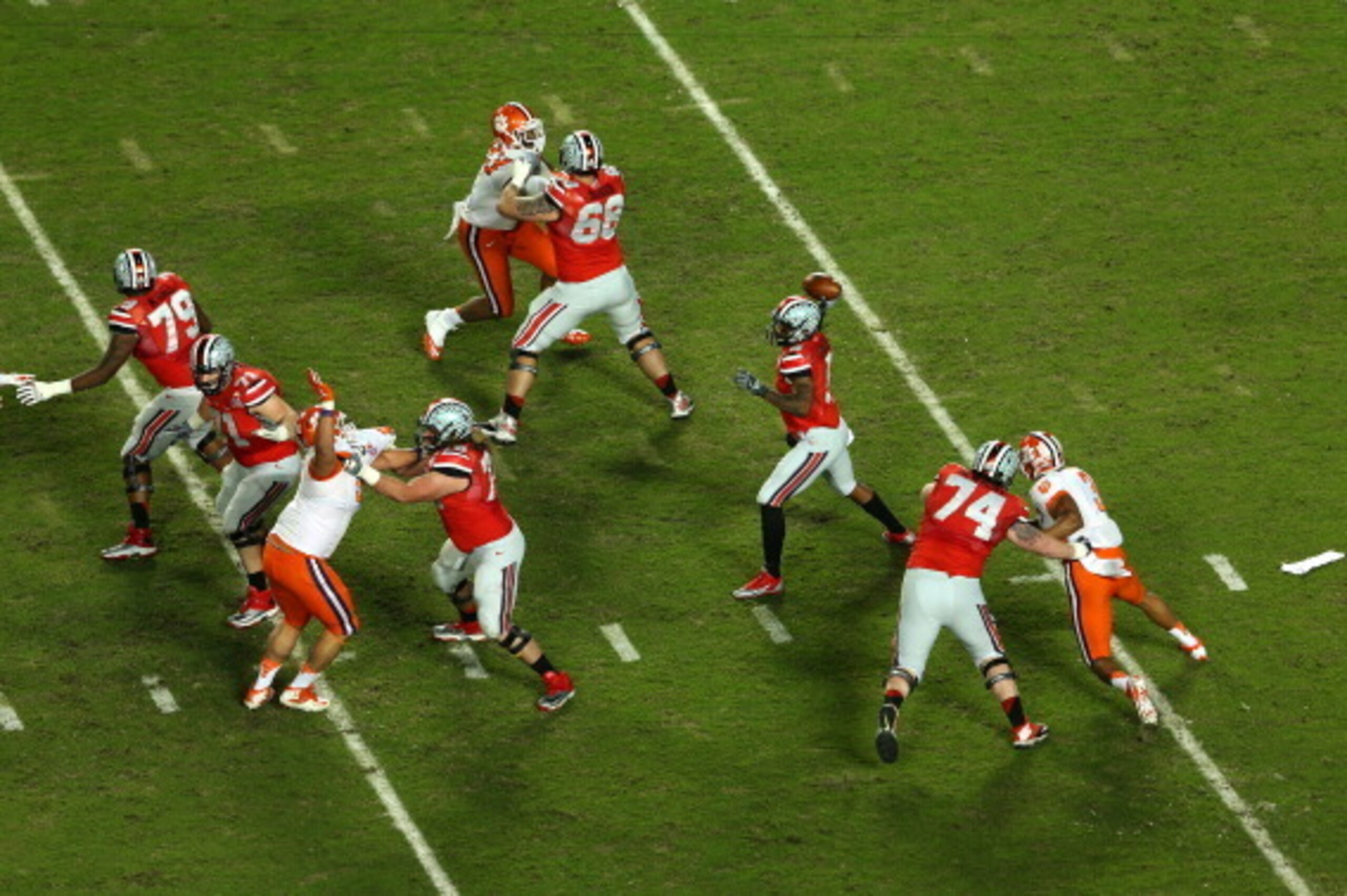 MIAMI GARDENS, FL - JANUARY 03: Braxton Miller #5 of the Ohio State Buckeyes looks to pass in the first quarter against the Clemson Tigers during the Discover Orange Bowl at Sun Life Stadium on January 3, 2014 in Miami Gardens, Florida.  (Photo by Mike Eh