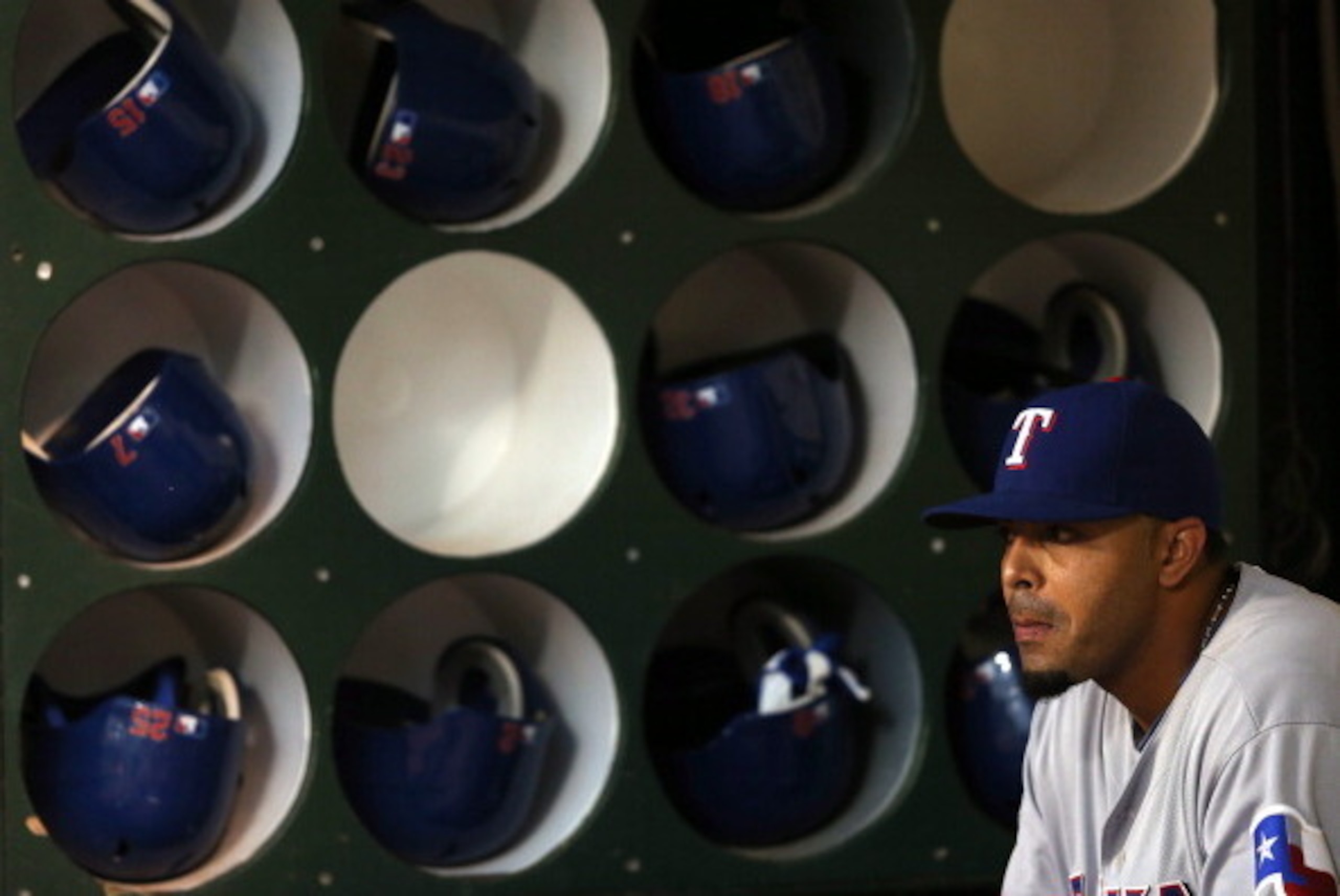 OAKLAND, CA - OCTOBER 02:  Nelson Cruz #17 of the Texas Rangers sits in the dugout before their game against the Oakland Athletics  at O.co Coliseum on October 2, 2012 in Oakland, California.  (Photo by Ezra Shaw/Getty Images)
