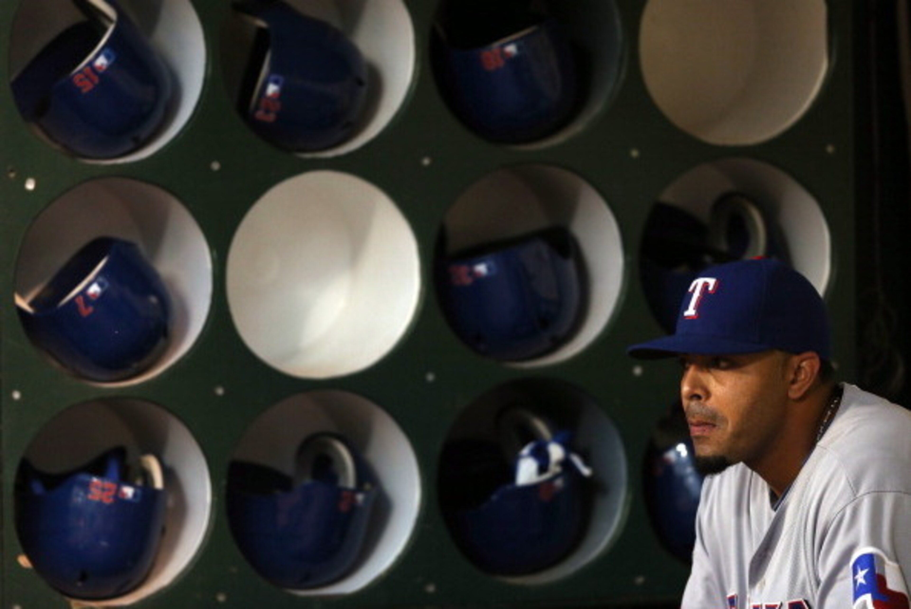 OAKLAND, CA - OCTOBER 02:  Nelson Cruz #17 of the Texas Rangers sits in the dugout before their game against the Oakland Athletics  at O.co Coliseum on October 2, 2012 in Oakland, California.  (Photo by Ezra Shaw/Getty Images)