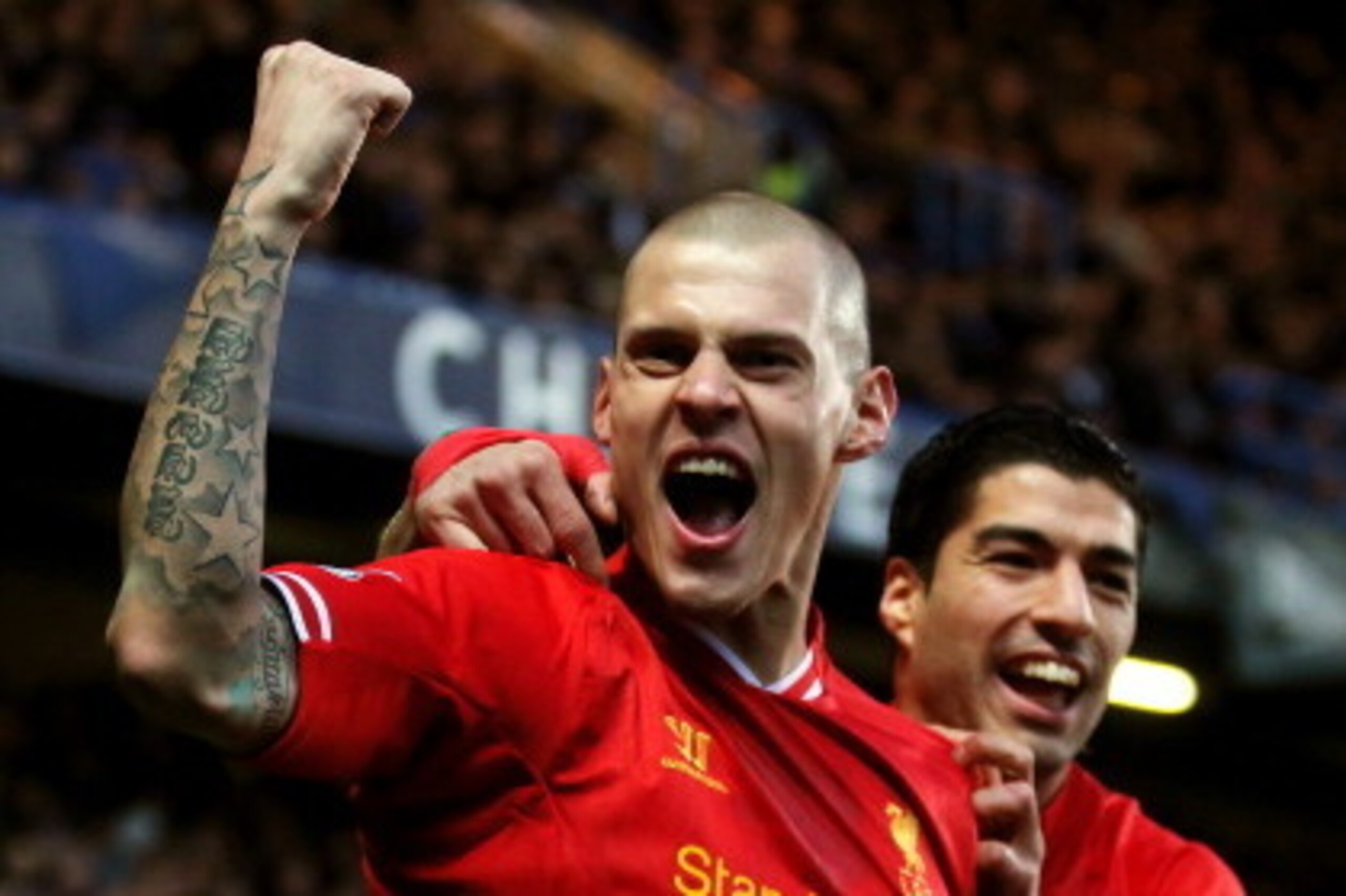 LONDON, ENGLAND - DECEMBER 29:  Martin Skrtel of Liverpool celebrates with teammate Luis Suarez (R)after scoring the opening goal during the Barclays Premier League match between Chelsea and Liverpool at Stamford Bridge on December 29, 2013 in London, Eng
