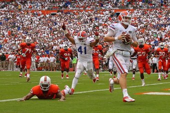 MIAMI GARDENS, FL - SEPTEMBER 07:  Jeff Driskel #6 of the Florida Gators rushes for a touchdown during a game against the Miami Hurricanes at Sun Life Stadium on September 7, 2013 in Miami Gardens, Florida.  (Photo by Mike Ehrmann/Getty Images)