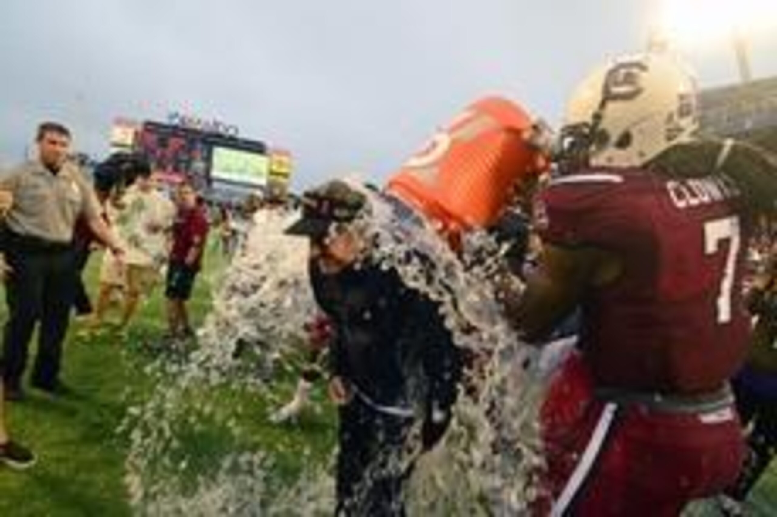 Jan 1, 2014; Orlando, FL, USA; South Carolina Gamecocks head coach Steve Spurrier has the water cooler dumped on him by defensive end Jadeveon Clowney (7) as the South Carolina Gamecocks beat the Wisconsin Badgers 34-24 in the Capital One Bowl at Florida 