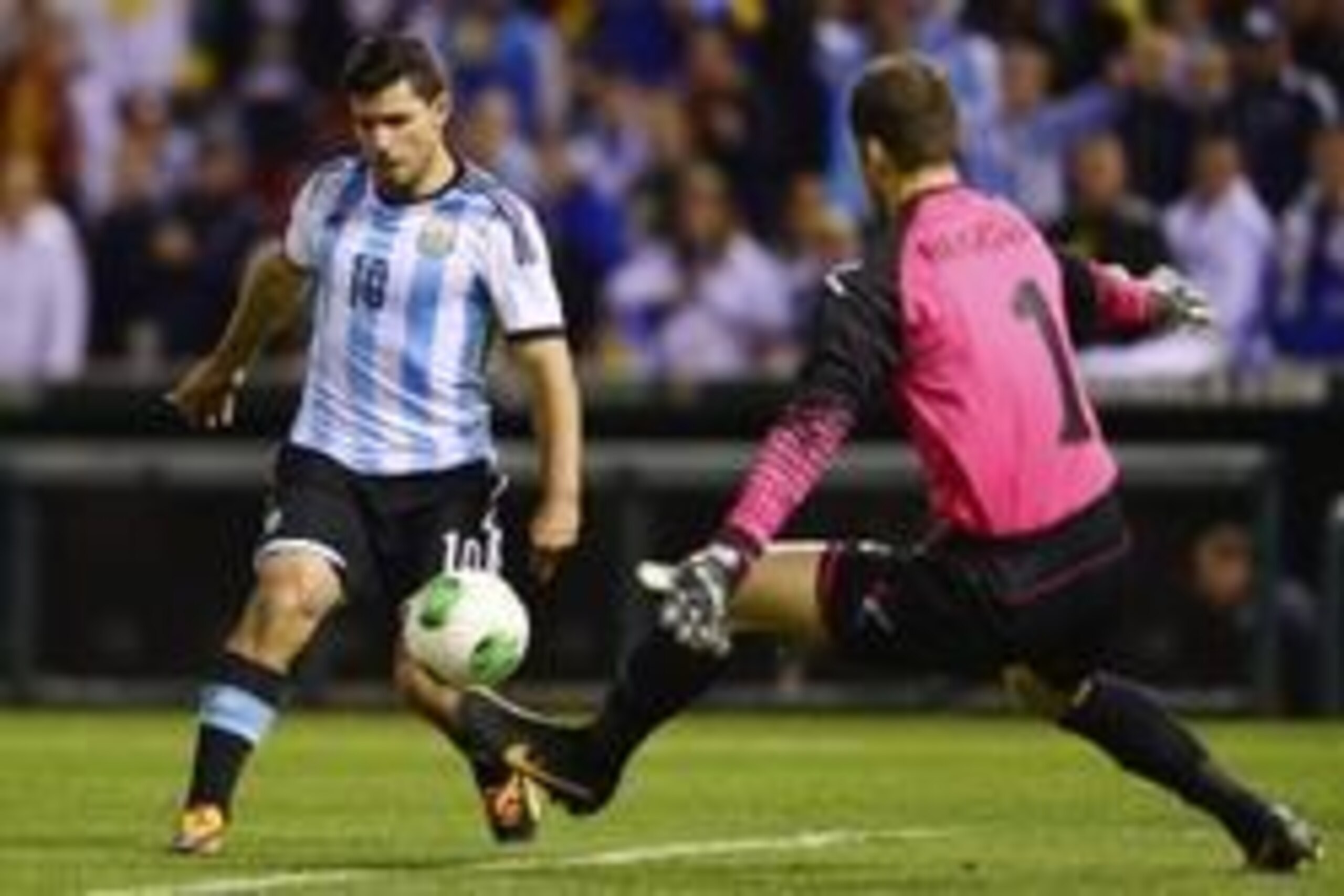 Nov 18, 2013; St. Louis, MO, USA; Argentina forward Sergio Ag  ero (10) shoots the ball against Bosnia and Herzegovina goal keeper Asmir Begovic (1) during the first half at Busch Stadium. Mandatory Credit: Jasen Vinlove-USA TODAY Sports