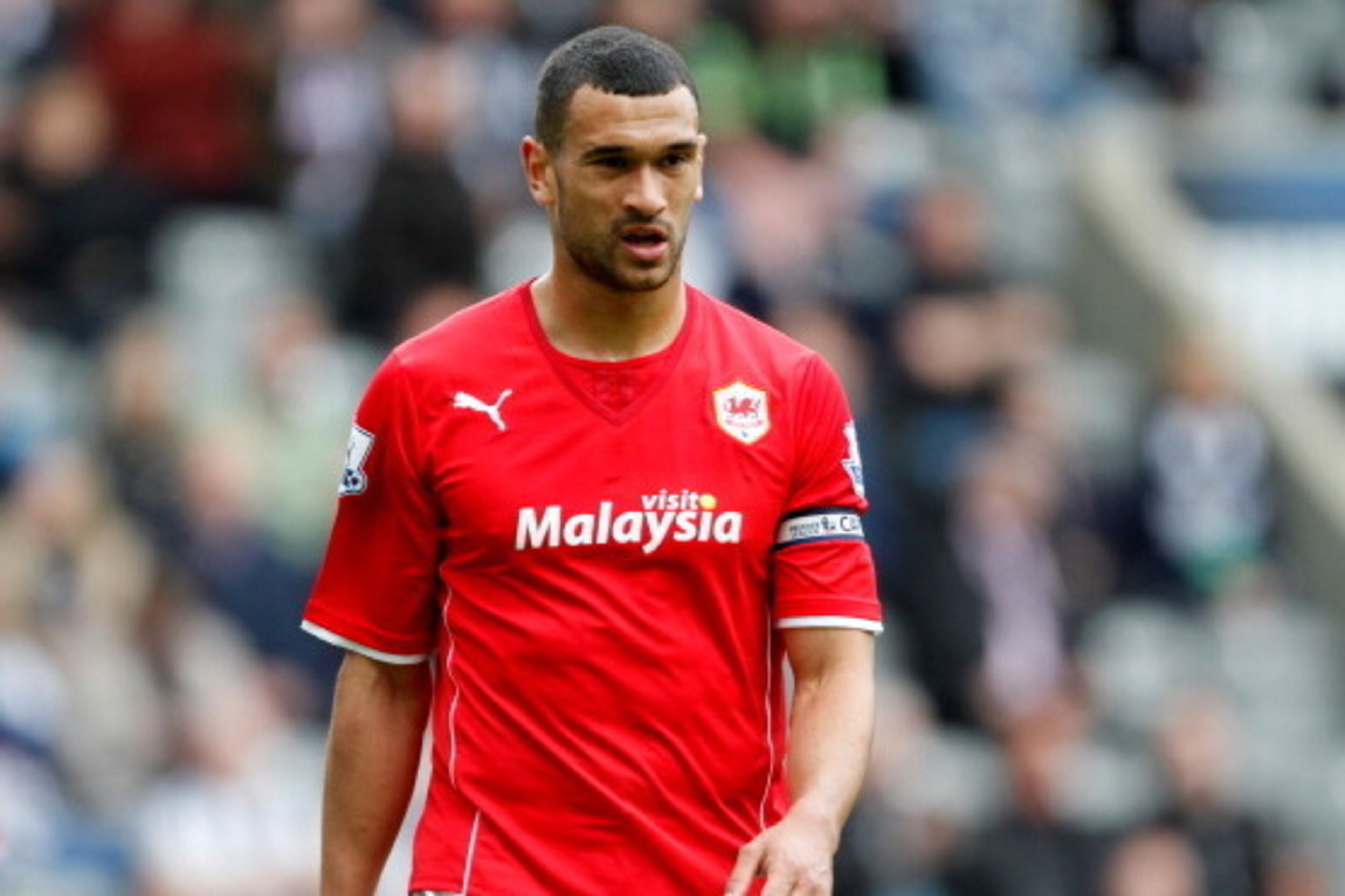 NEWCASTLE, ENGLAND- May 03: Cardiff City's Steven Caulker looks dejected after his team are relegated during the Barclays Premier League match between Newcastle United and Cardiff City at St. James' Park on May 03, 2014 in Newcastle upon Tyne, England. NEWCASTLE, ENGLAND- May 03: Cardiff City's Steven Caulker looks dejected after his team are relegated during the Barclays Premier League match between Newcastle United and Cardiff City at St. James' Park on May 03, 2014 in Newcastle upon Tyne, England.