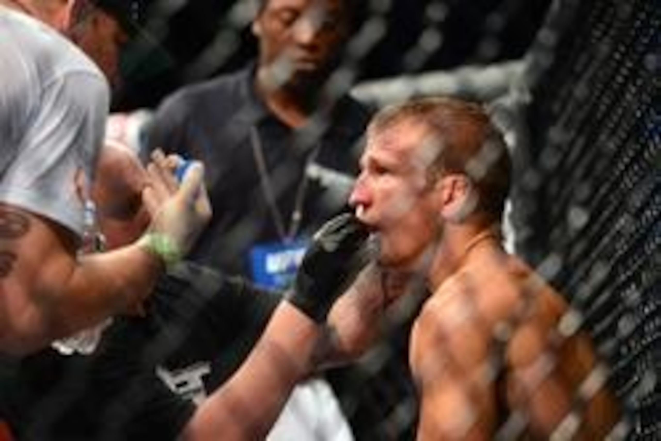 Oct 9, 2013; Barueri, Sao Paulo, Brazil;  TJ Dillashaw (black shorts) is tended to during his match against Raphael Assuncao  (not pictured) during UFC Fight Night 29 at Jose Correa Arena. Mandatory Credit: Jason Silva-USA TODAY Sports