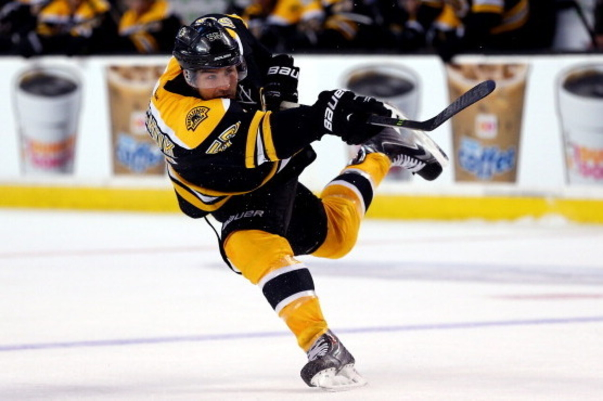 BOSTON, MA - MARCH 01:  Johnny Boychuk #55 of the Boston Bruins takes a shot against the Washington Capitals during a game at the TD Garden on March 1, 2014 in Boston, Massachusetts.  (Photo by Alex Trautwig/Getty Images)