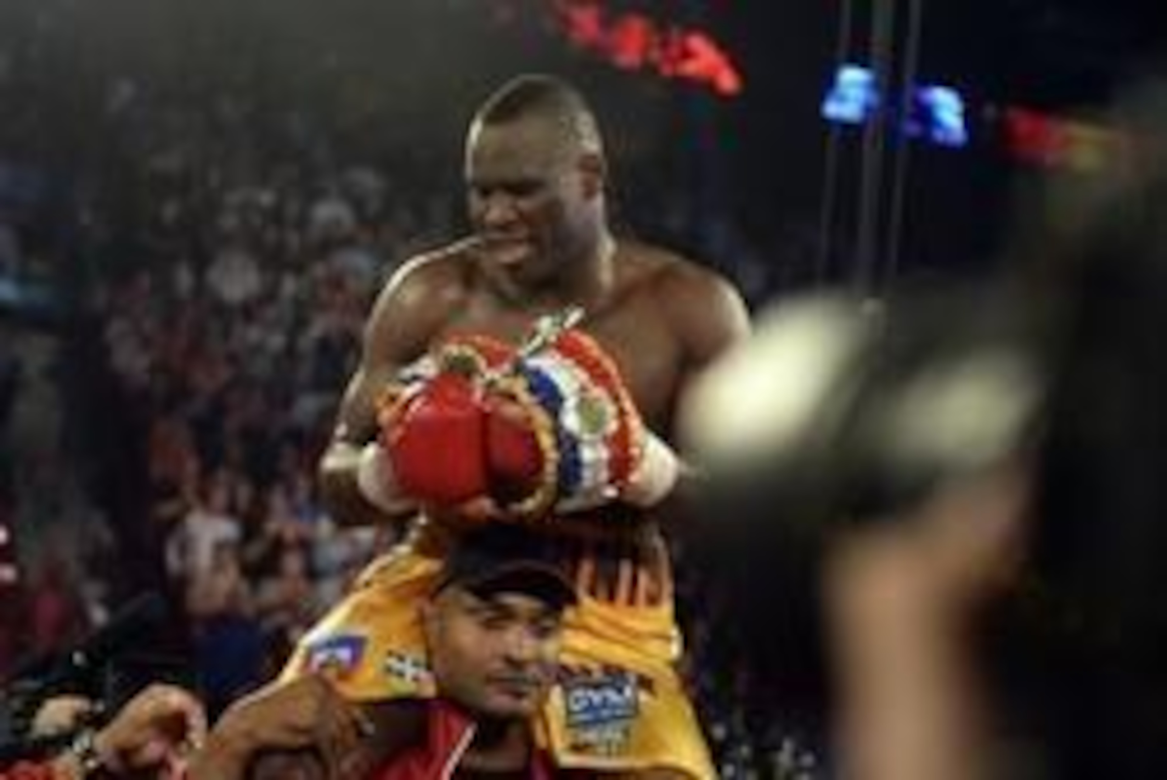Sep 28, 2013; Montreal, Quebec, Canada;  Adonis Stevenson (yellow trunks) celebrates winning his light-heavyweight WBC world championship bout  against Tavoris Cloud (not pictured) at the Bell Centre. Mandatory Credit: Eric Bolte-USA TODAY Sports