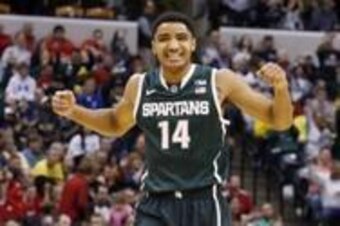 Mar 15, 2014; Indianapolis, IN, USA; Michigan State Spartans guard Gary Harris (14) reacts to a score by the Spartans in a game against the Wisconsin Badgers in the semifinals of the Big Ten college basketball tournament at Bankers Life Fieldhouse. Mandat
