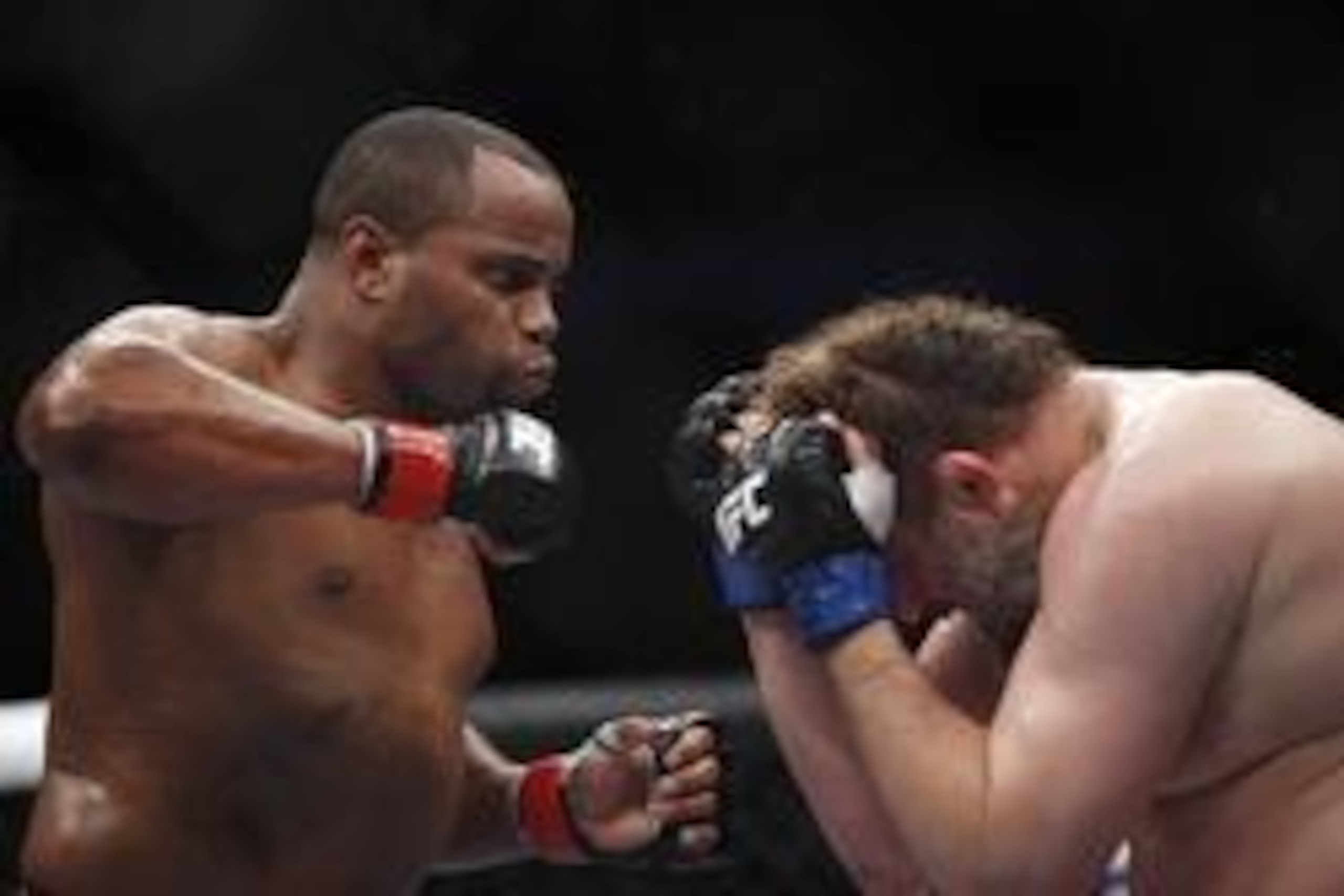 Oct 19, 2013; Houston, TX, USA; Daniel Cormier (red gloves) fights against Roy Nelson (blue gloves) in their heavyweight bout during UFC 166 at Toyota Center. Mandatory Credit: Andrew Richardson-USA TODAY Sports