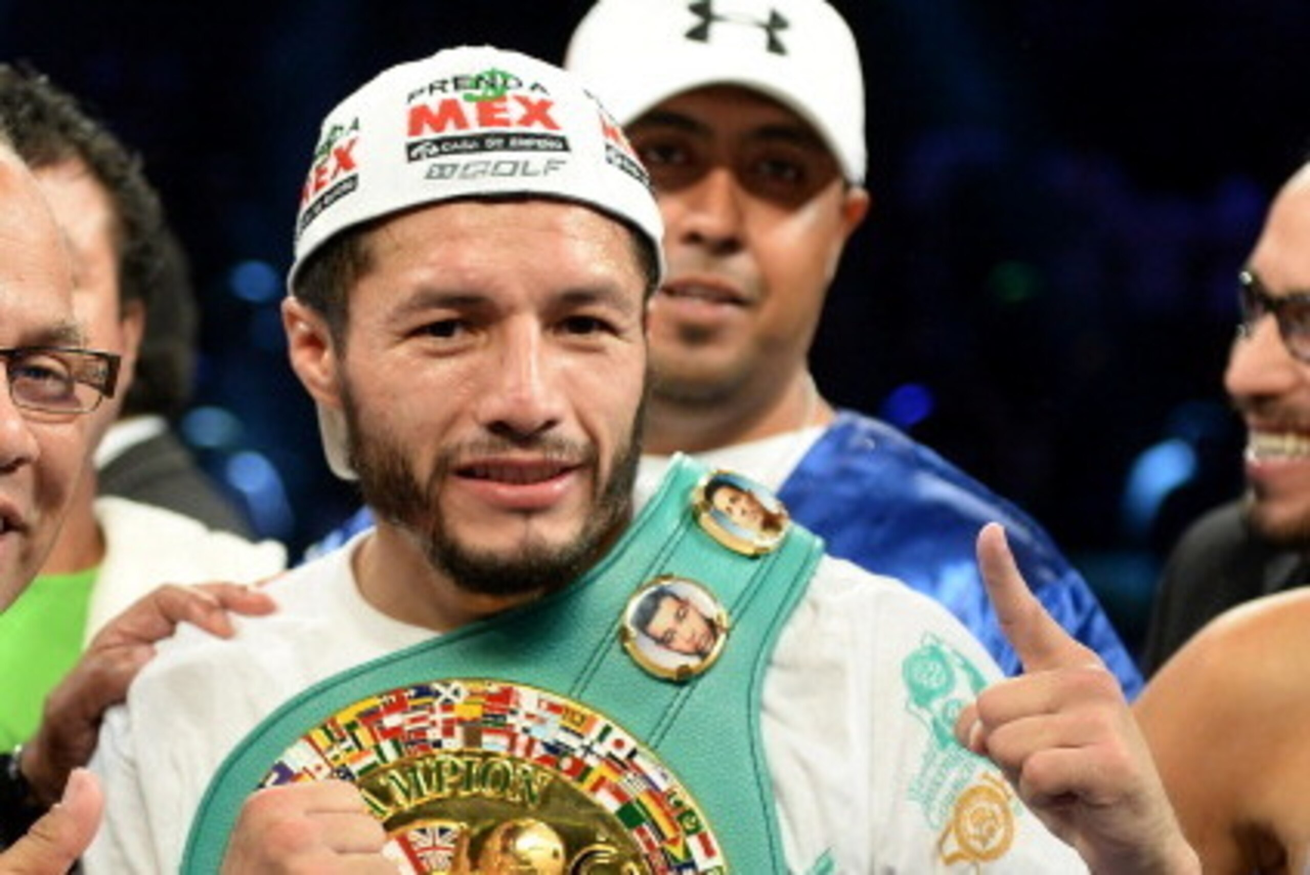 CARSON, CA - AUGUST 24:  Jhonny Gonzalez poses with the belt as he beats Abner Mares in a first round konckout during the WBC Featherweight Title Fight at the StubHub Center on August 24, 2013 in Carson, California.  (Photo by Harry How/Getty Images)