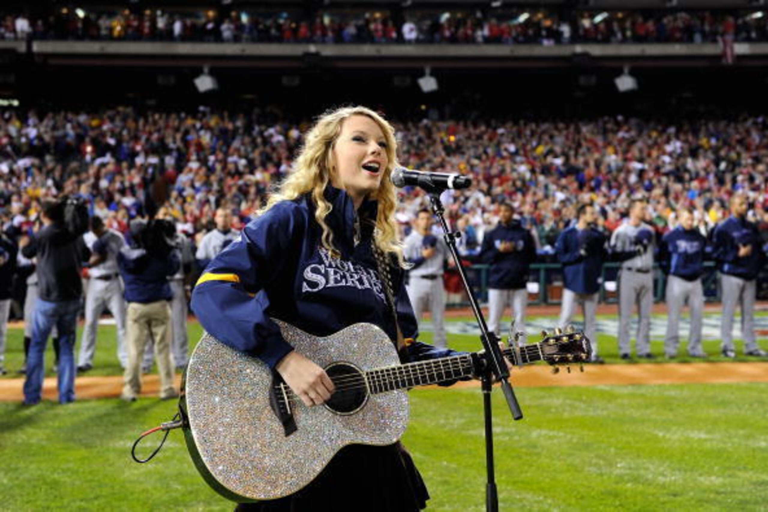 PHILADELPHIA - OCTOBER 25:  Taylor Swift performs the national anthem before the Philadelphia Phillies take on the Tampa Bay Rays in game three of the 2008 MLB World Series on October 25, 2008 at Citizens Bank Park in Philadelphia, Pennsylvania.  (Photo b