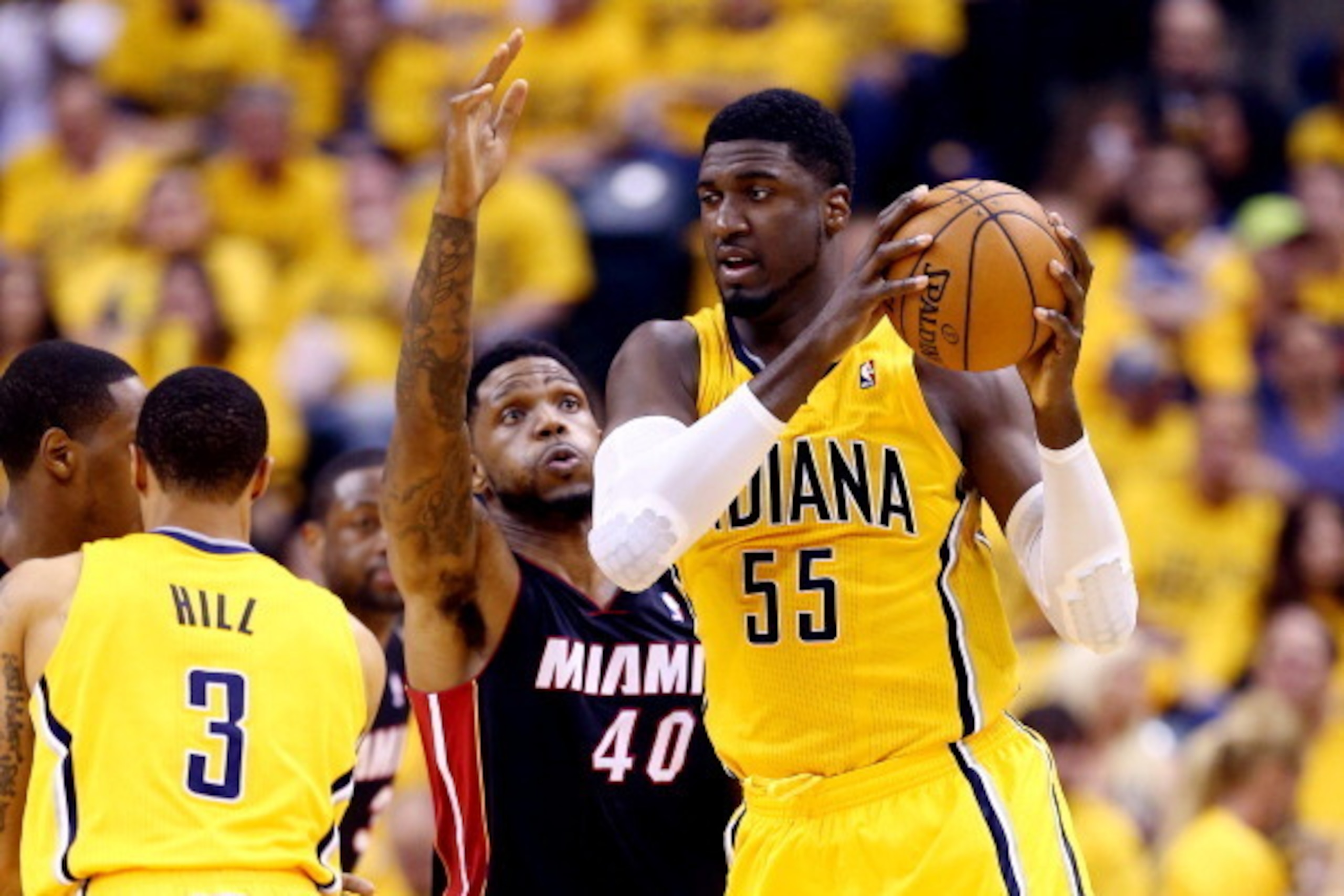 INDIANAPOLIS, IN - MAY 20: Roy Hibbert #55 of the Indiana Pacers looks to pass as Udonis Haslem #40 of the Miami Heat defends during Game Two of the Eastern Conference Finals of the 2014 NBA Playoffs at at Bankers Life Fieldhouse on May 20, 2014 in Indian