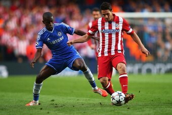 LONDON, ENGLAND - APRIL 30: Koke of Club Atletico de Madrid is tackled by Ramires of Chelsea during the UEFA Champions League semi-final second leg match between Chelsea and Club Atletico de Madrid at Stamford Bridge on April 30, 2014 in London, England. 