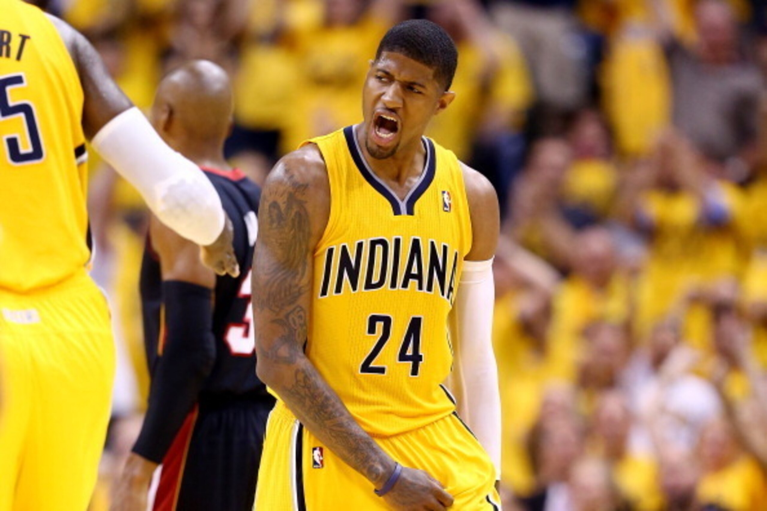 INDIANAPOLIS, IN - MAY 20:  Paul George #24 of the Indiana Pacers reacts against the Miami Heat during Game Two of the Eastern Conference Finals of the 2014 NBA Playoffs at at Bankers Life Fieldhouse on May 20, 2014 in Indianapolis, Indiana. NOTE TO USER: