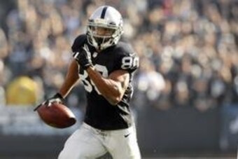 Dec 15, 2013; Oakland, CA, USA; Oakland Raiders wide receiver Rod Streater (80) runs with the ball after catching a pass against the Kansas City Chiefs in the first quarter at O.co Coliseum. Mandatory Credit: Cary Edmondson-USA TODAY Sports