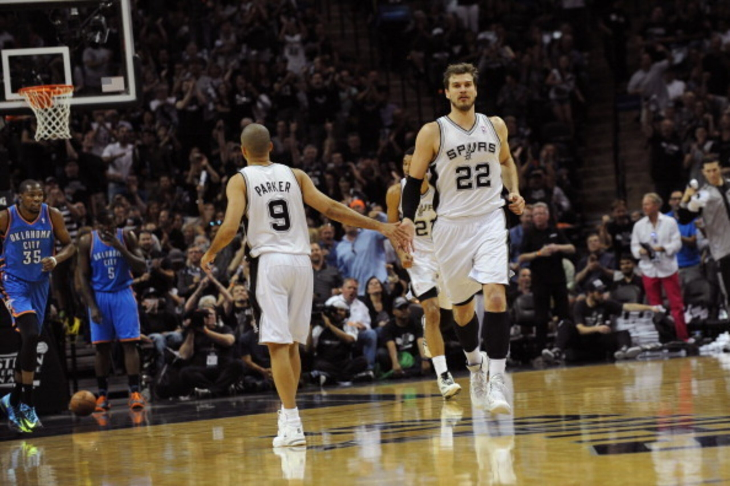 SAN ANTONIO, TX - MAY 21: Tiago Splitter #22 of the San Antonio Spurs celebrates against the Oklahoma City Thunder in Game Two of the Western Conference Finals during the 2014 NBA Playoffs on May 21, 2014 at the AT&T Center in San Antonio, Texas.  NOTE TO